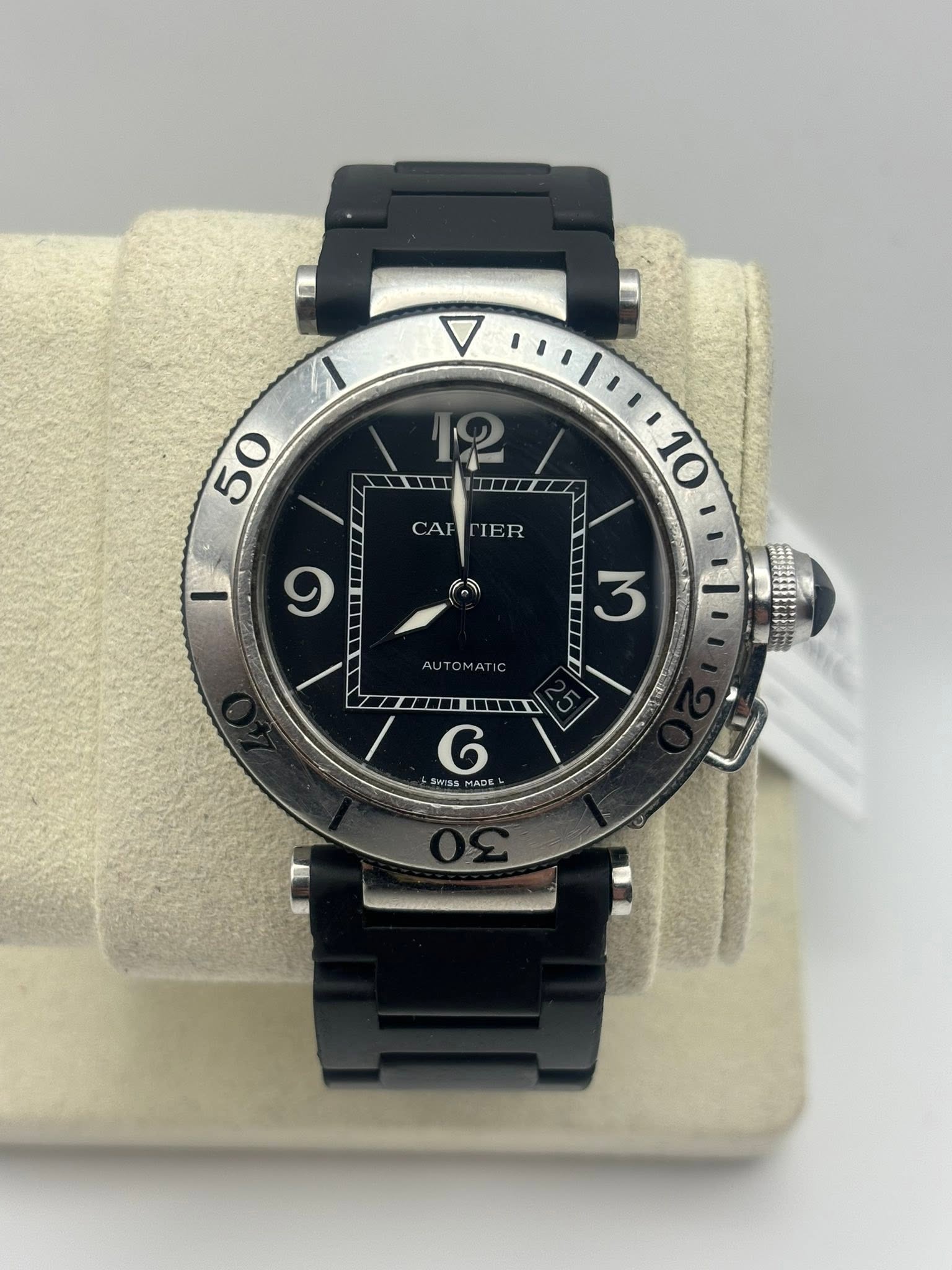 May be an image of wrist watch and text