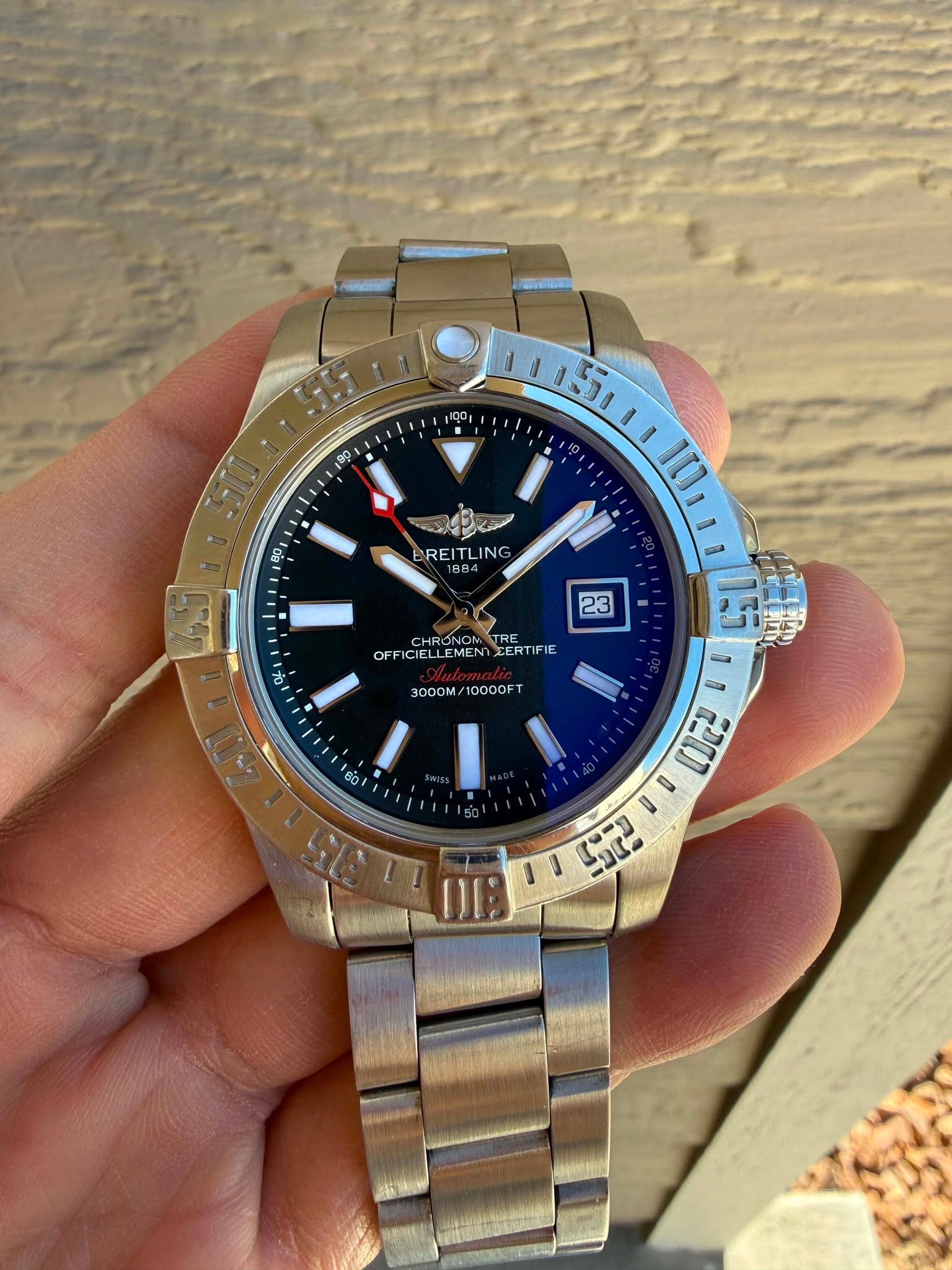 May be an image of wrist watch and text that says '100 80 B0 REI NG 884 1 23 1o CHR B OFFICICLLEMENT OFFICIELLEMENIZERTIFIE EMEN EERTIFIE FIE CIELLEMENT ICLLE 3000M/10000F1 3000M/…