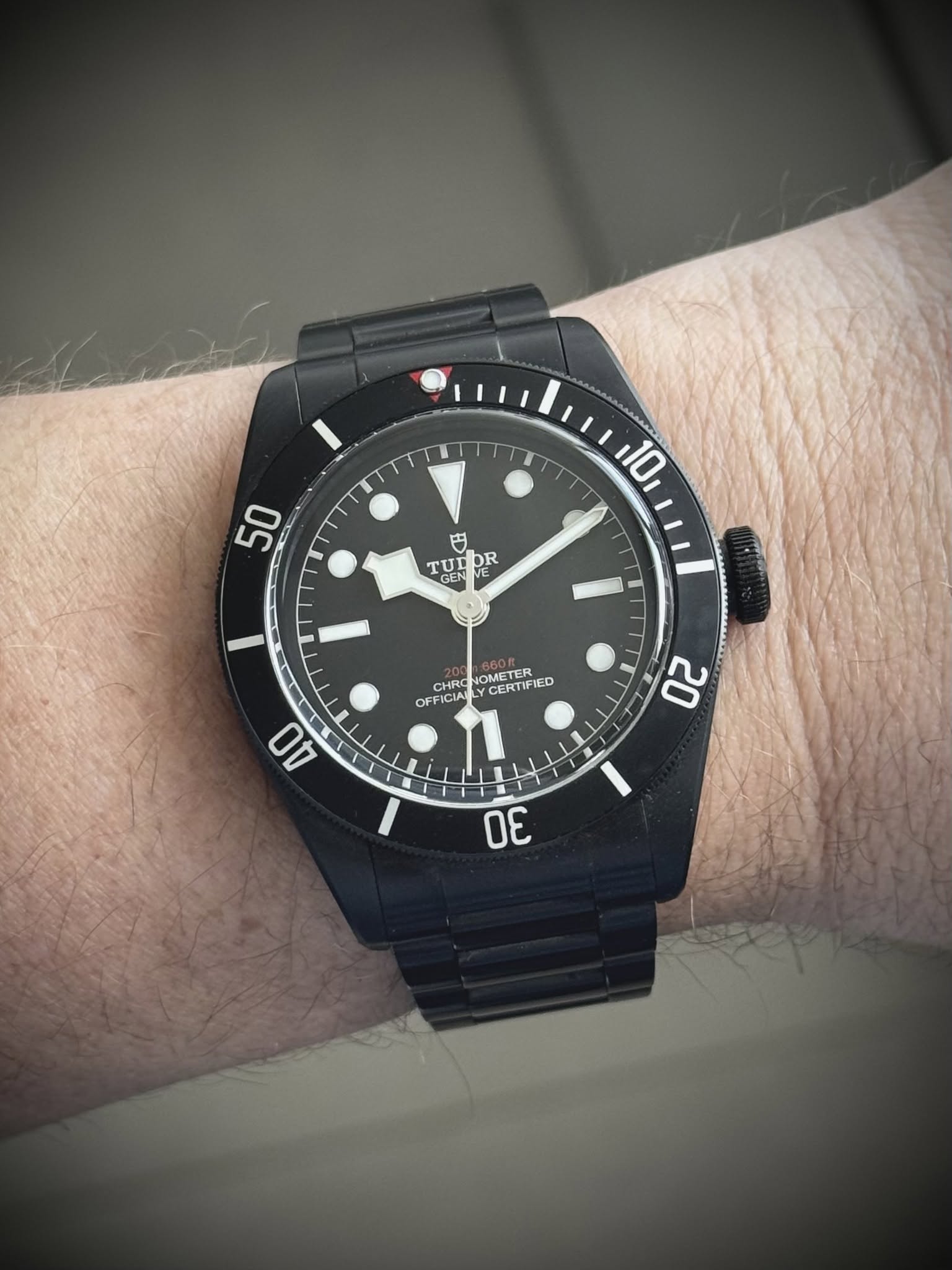 May be an image of wrist watch and text