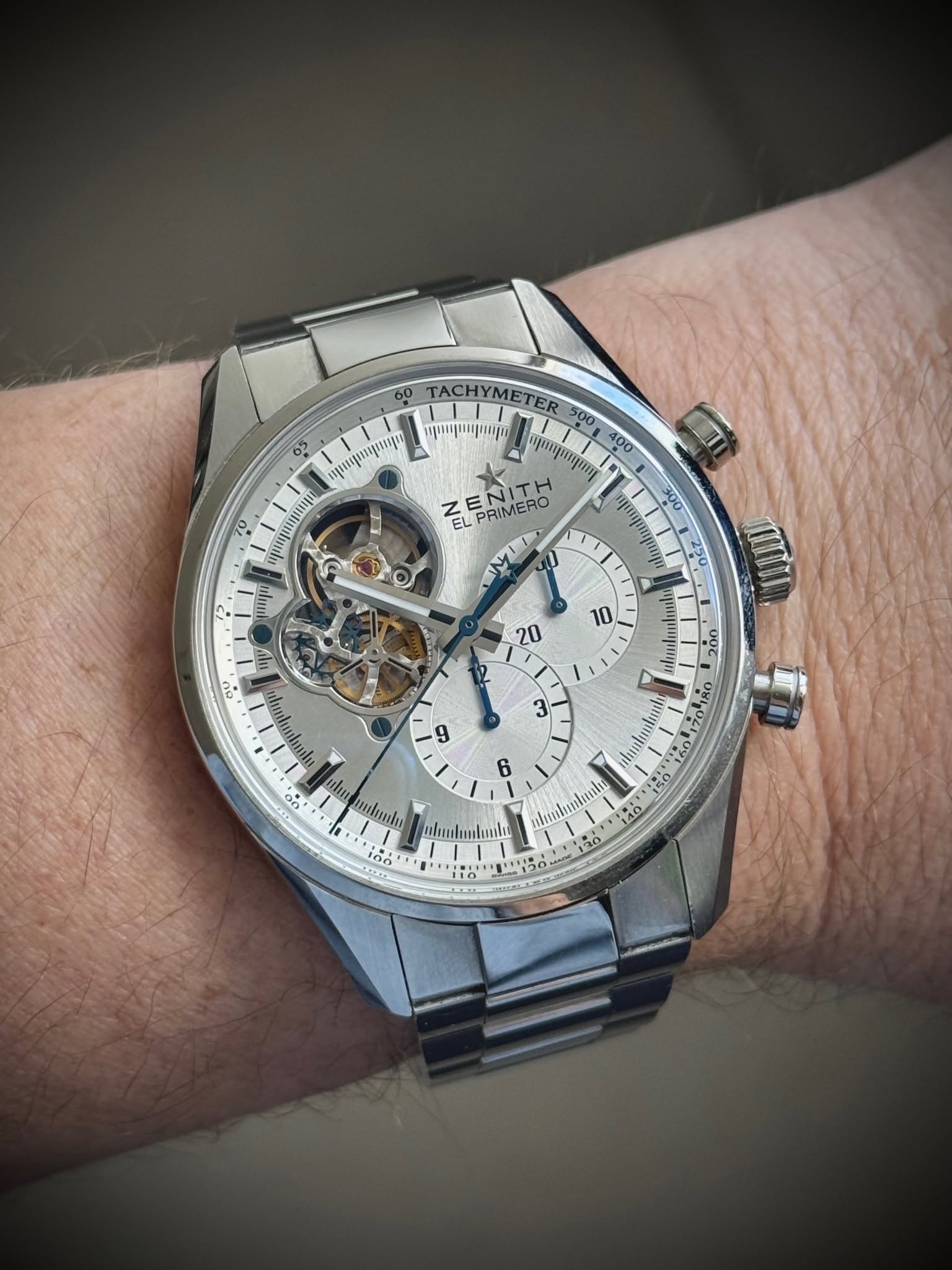 May be an image of wrist watch and text