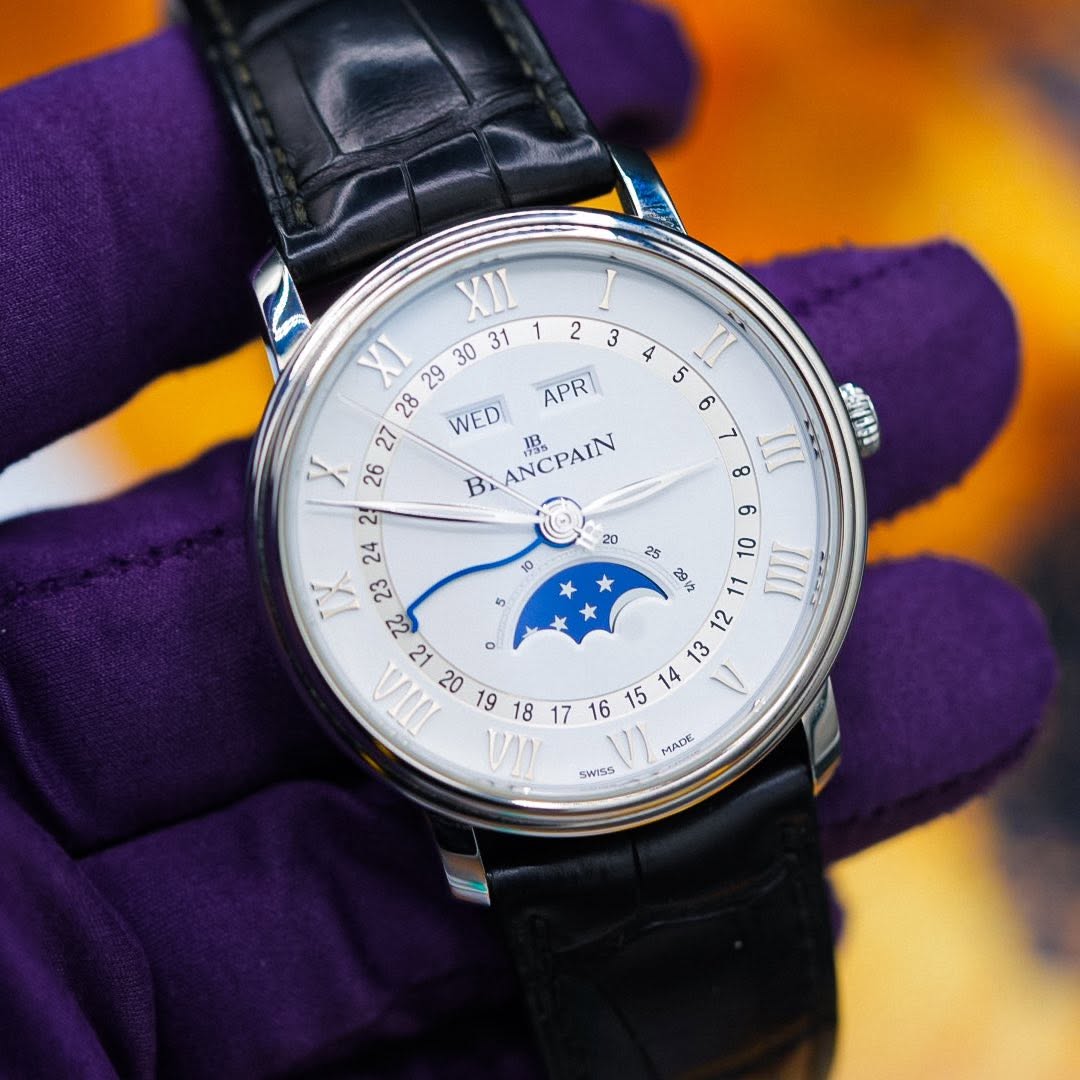 May be an image of wrist watch and text that says '2 3 4 5 II 6 ANAN 8 III XII XI WED APR 27 26 B BLANCPAIN 理 o 20 19 18 الكن * ¥ * 25 10 III =د 號 MADE MALE SWISS'
