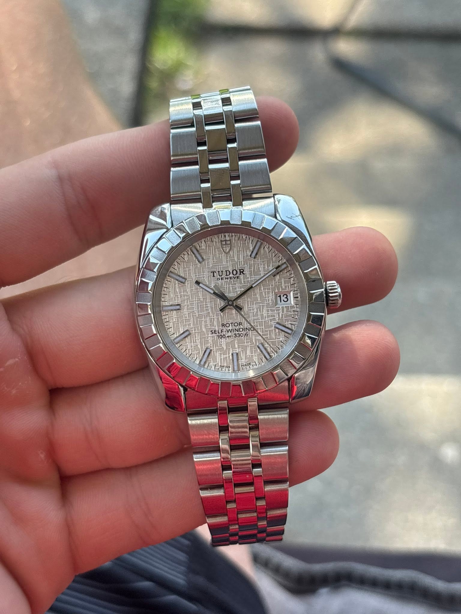 May be an image of wrist watch and text that says 'TUDOR 13| וש ROTOR'