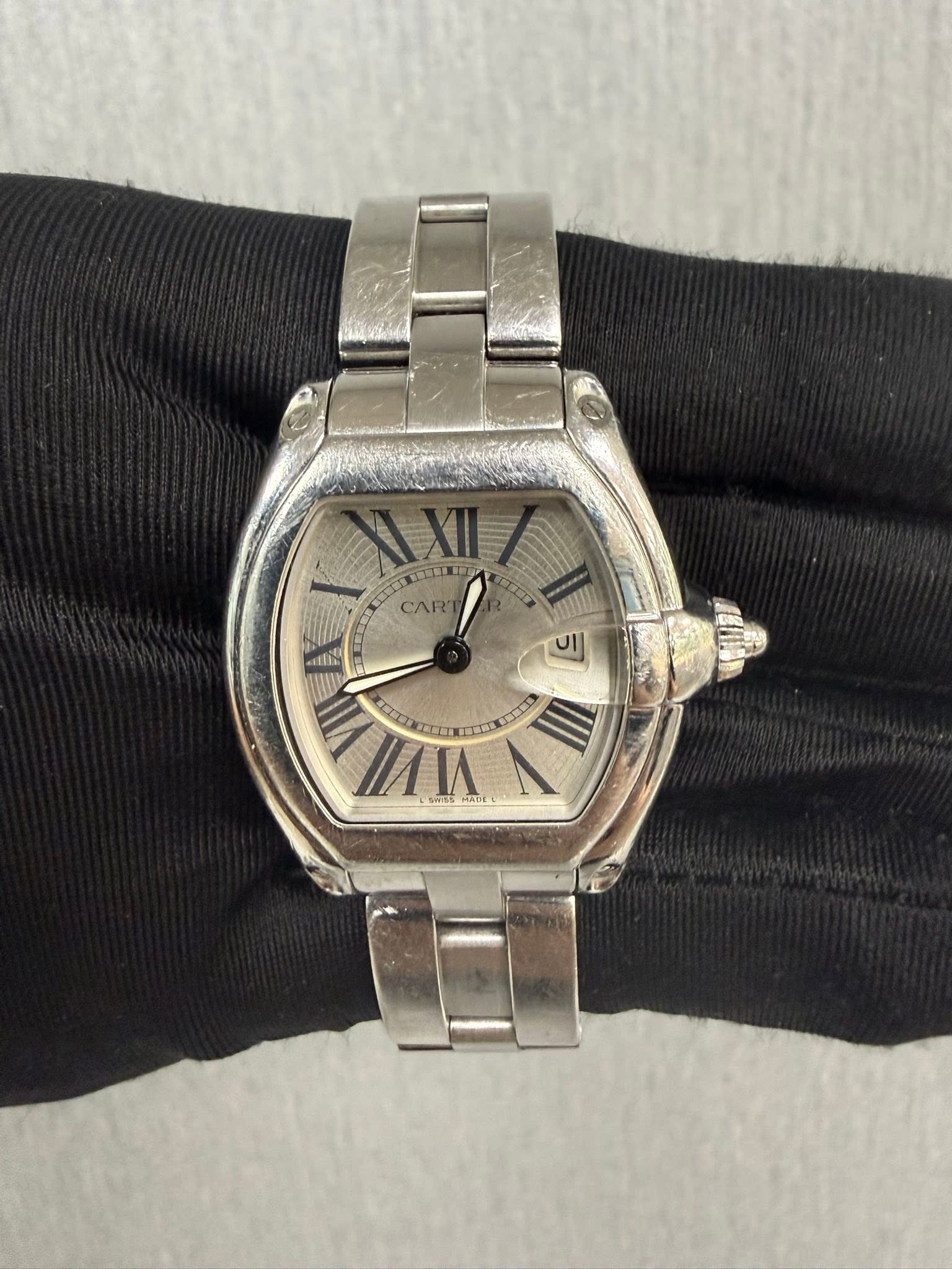 May be an image of wrist watch and text
