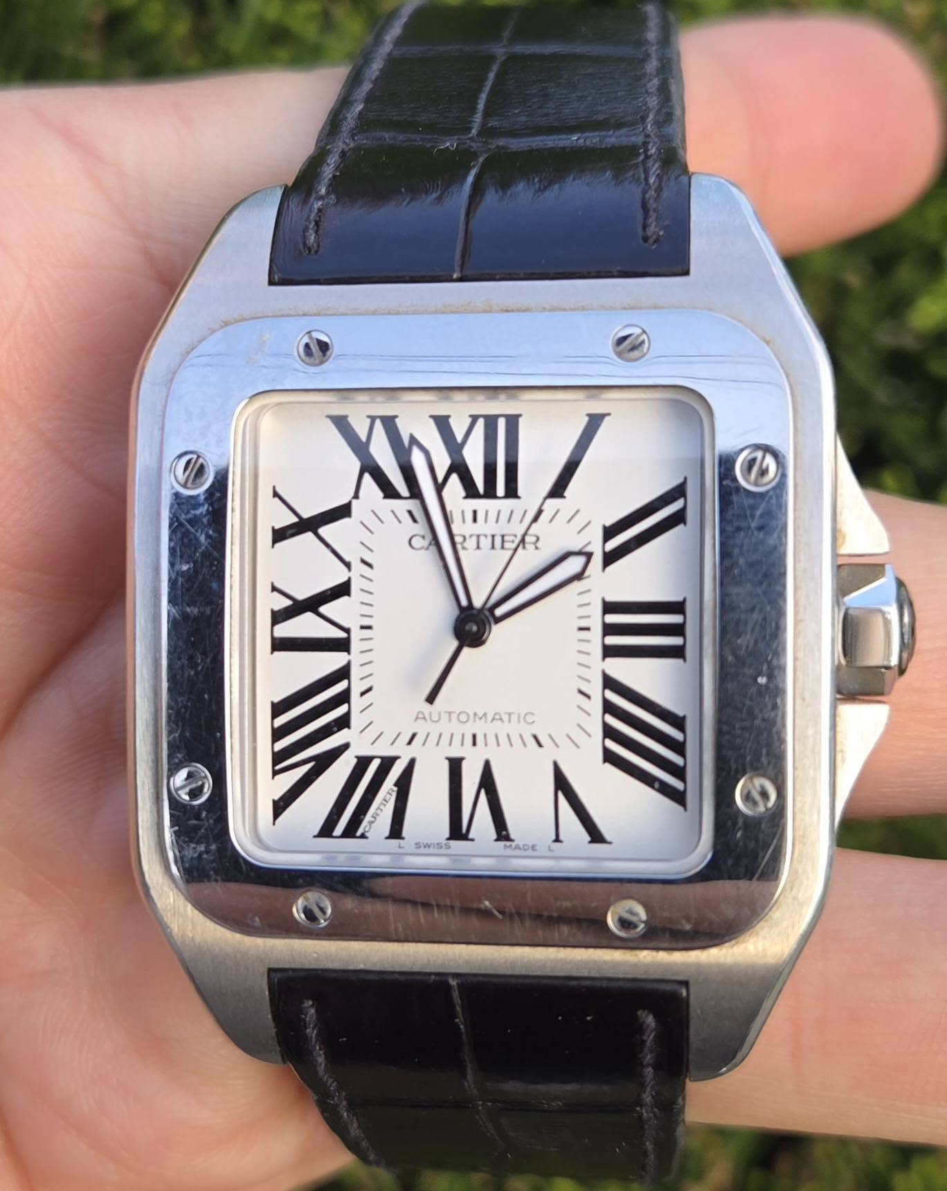 May be an image of wrist watch and text