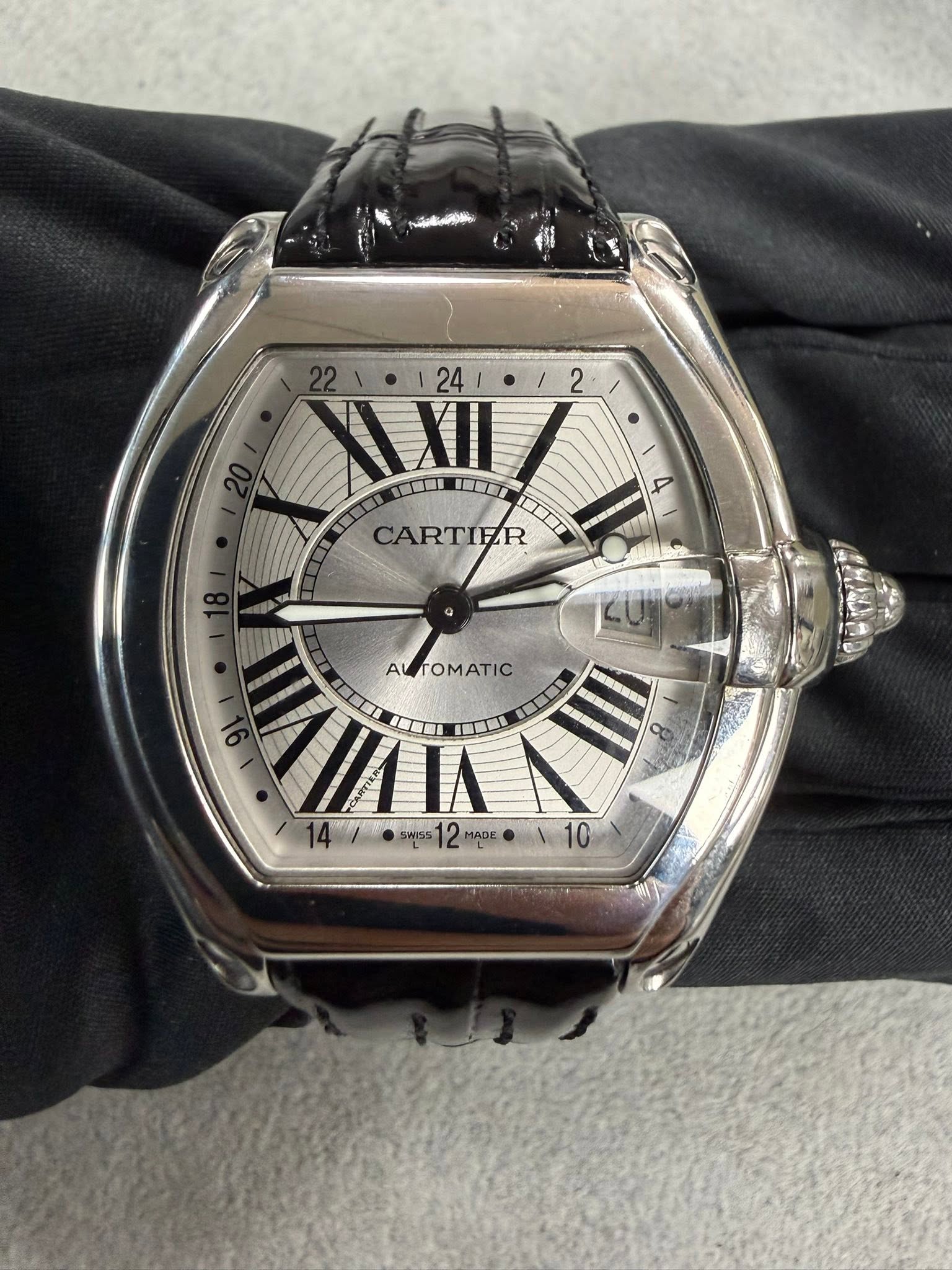 May be an image of wrist watch and text