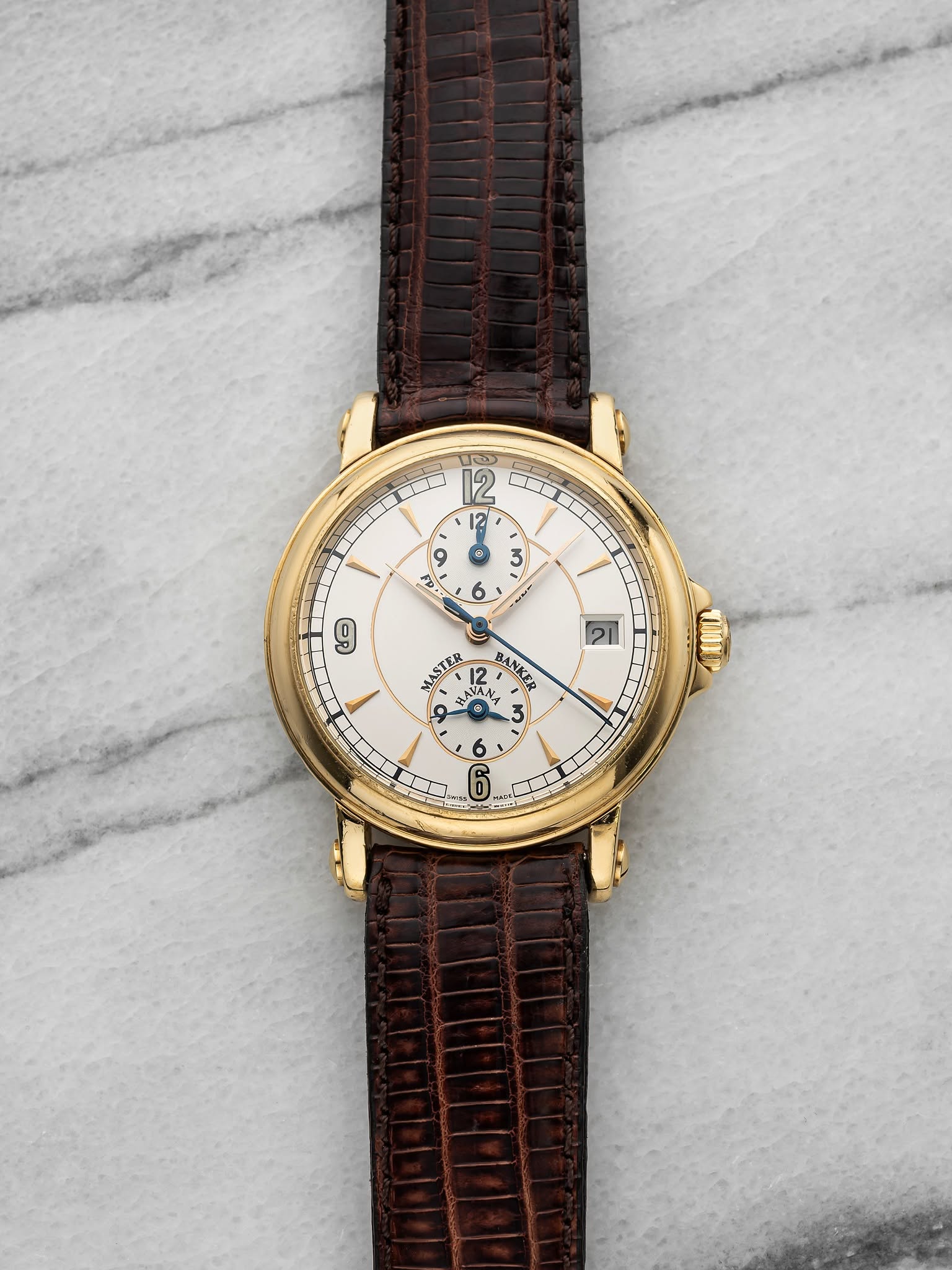 May be an image of leather, wrist watch and text