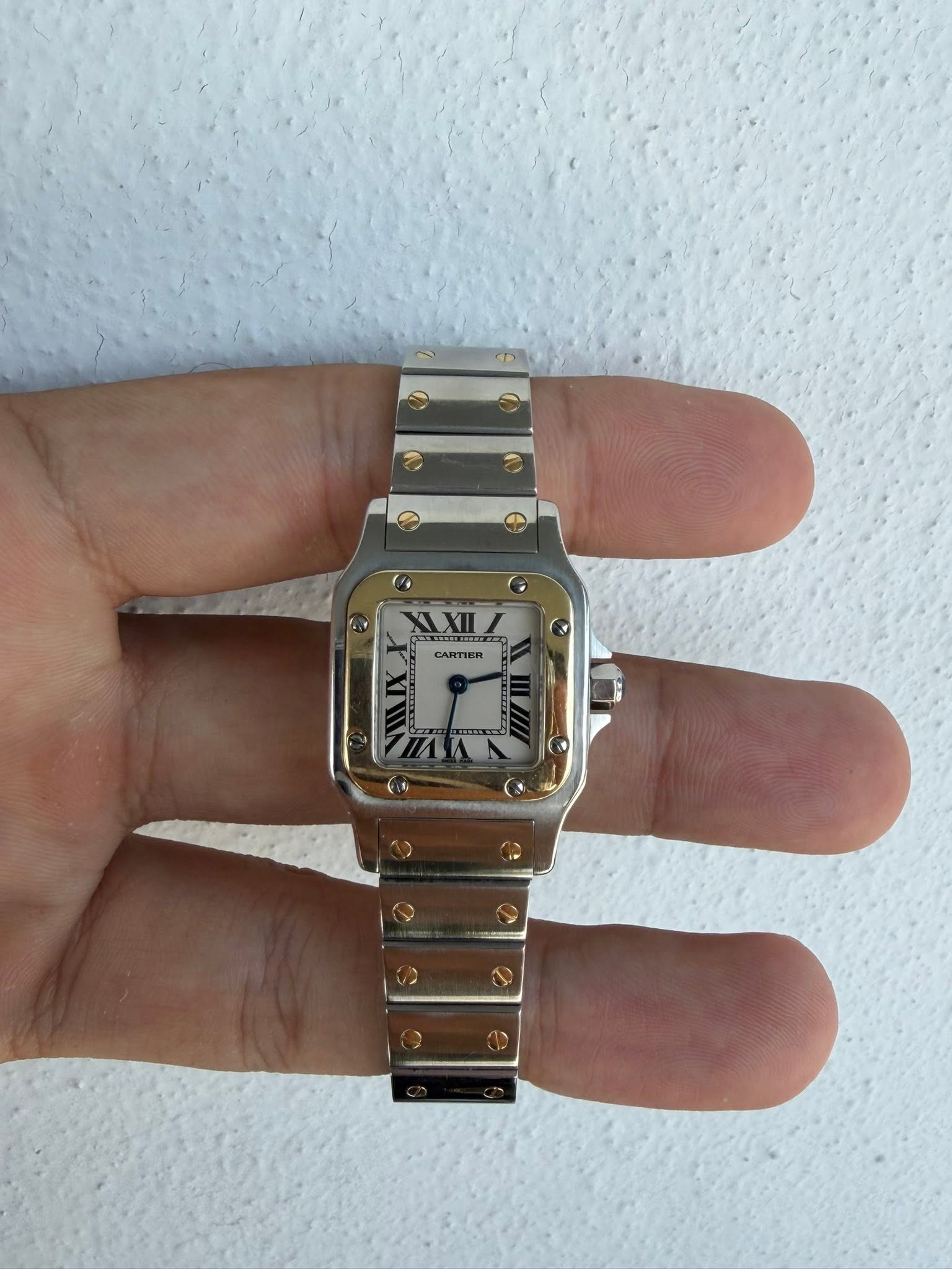 May be an image of digital watch and text that says 'CARTIER'