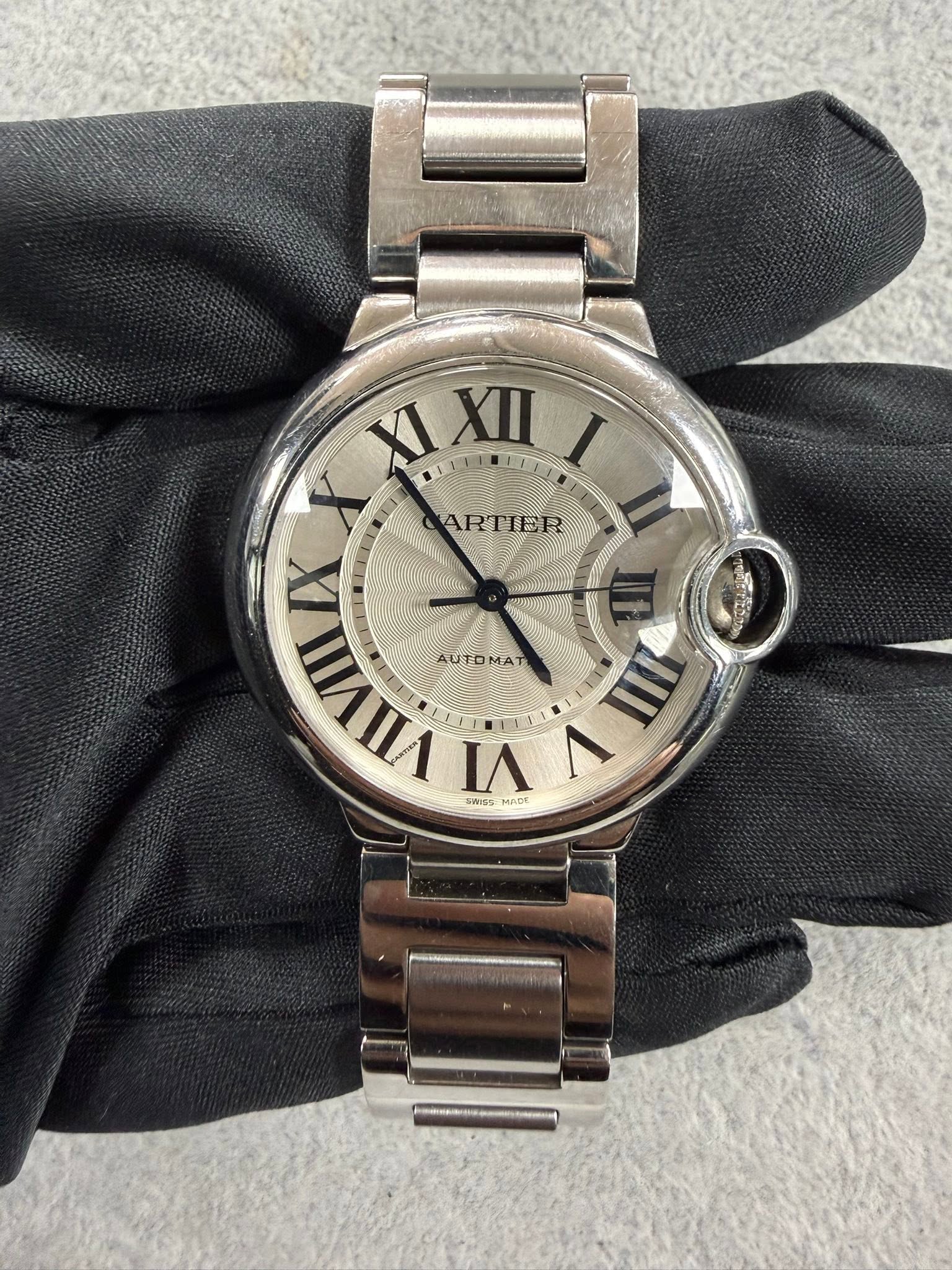 May be an image of wrist watch and text