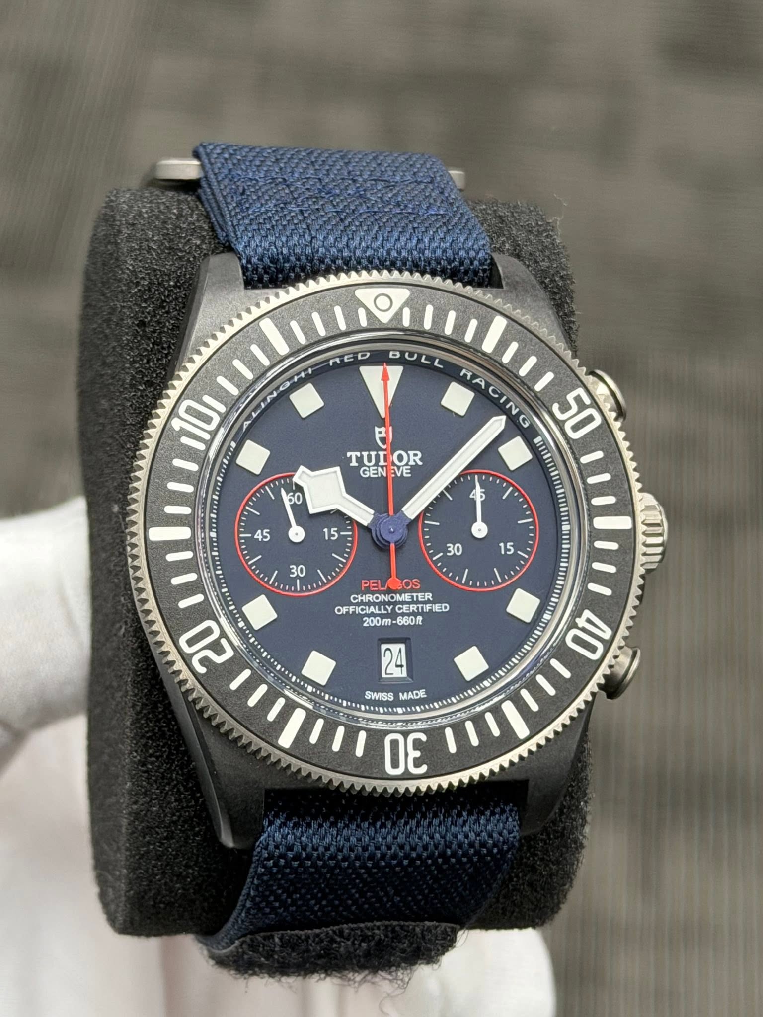 May be an image of wrist watch and text that says 'nED 10 IN DULL MACING 50 FI TUIOR OR TUI GENEVE GEN VE CHRONOMETER CHRONOM OFFK OFFICIALLY CERTIF CERTIFIE IED 200 -680R 20 MADE…