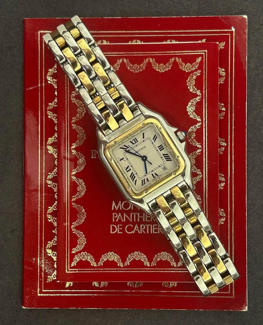 May be an image of wrist watch and text