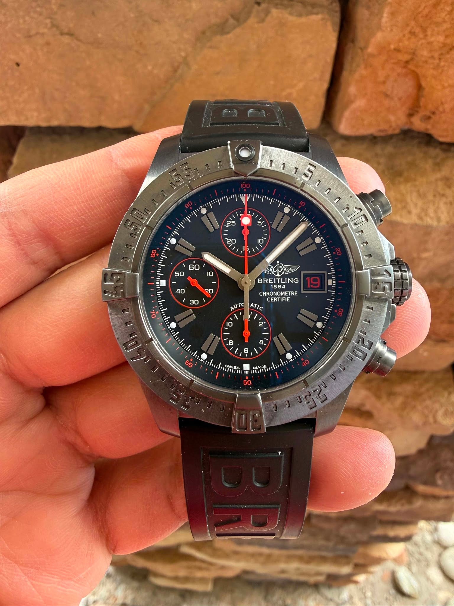 May be an image of wrist watch and text