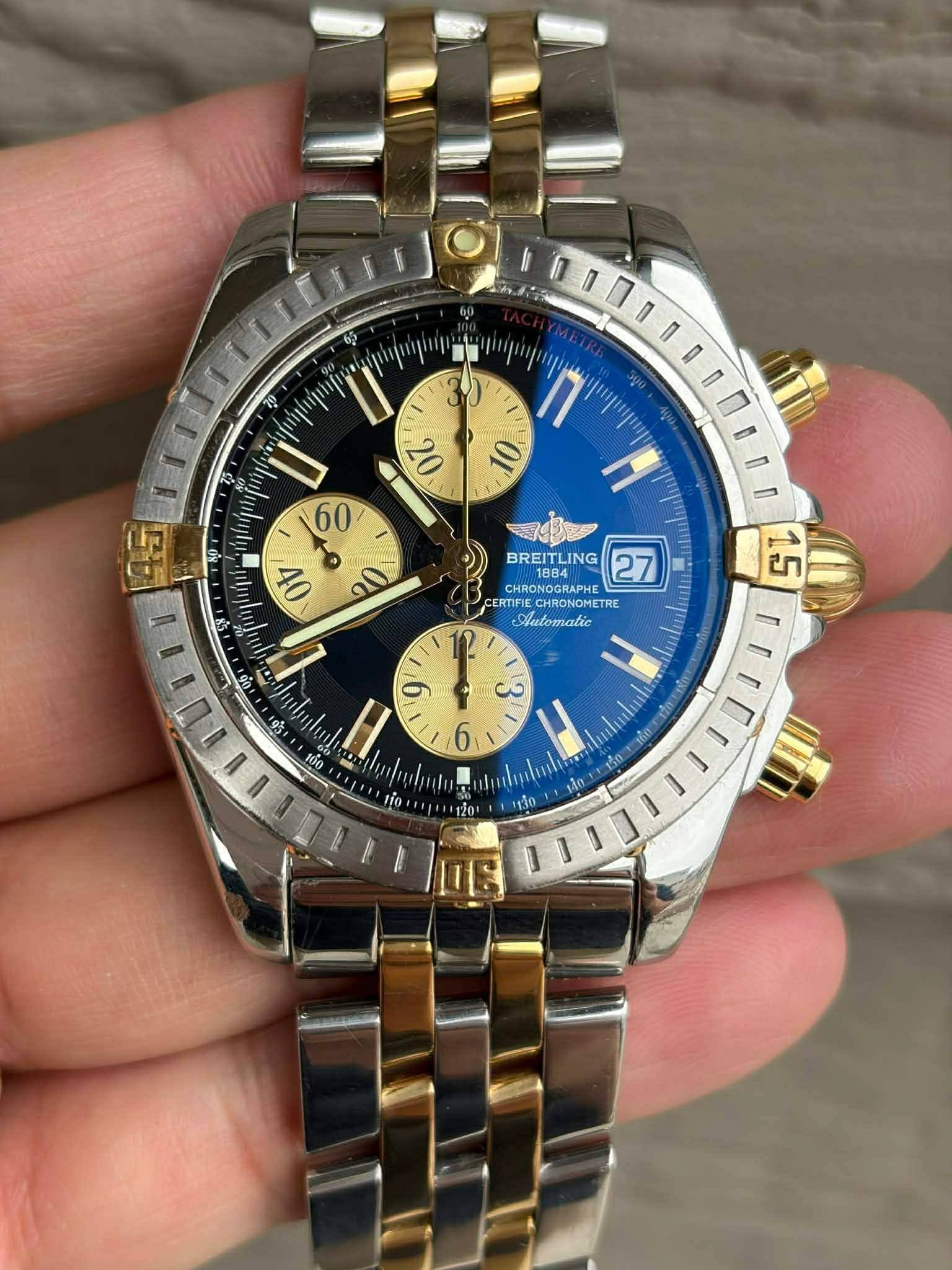 May be an image of wrist watch and text that says ' U 60 I 10 20 20 BREITLING BRE LING 27 R1884 1884 CHRON CHRONOGE RONOGRAPHE 0 ERTIFIE CHRONOMETR CHRONOMET TRE atomatic 50…