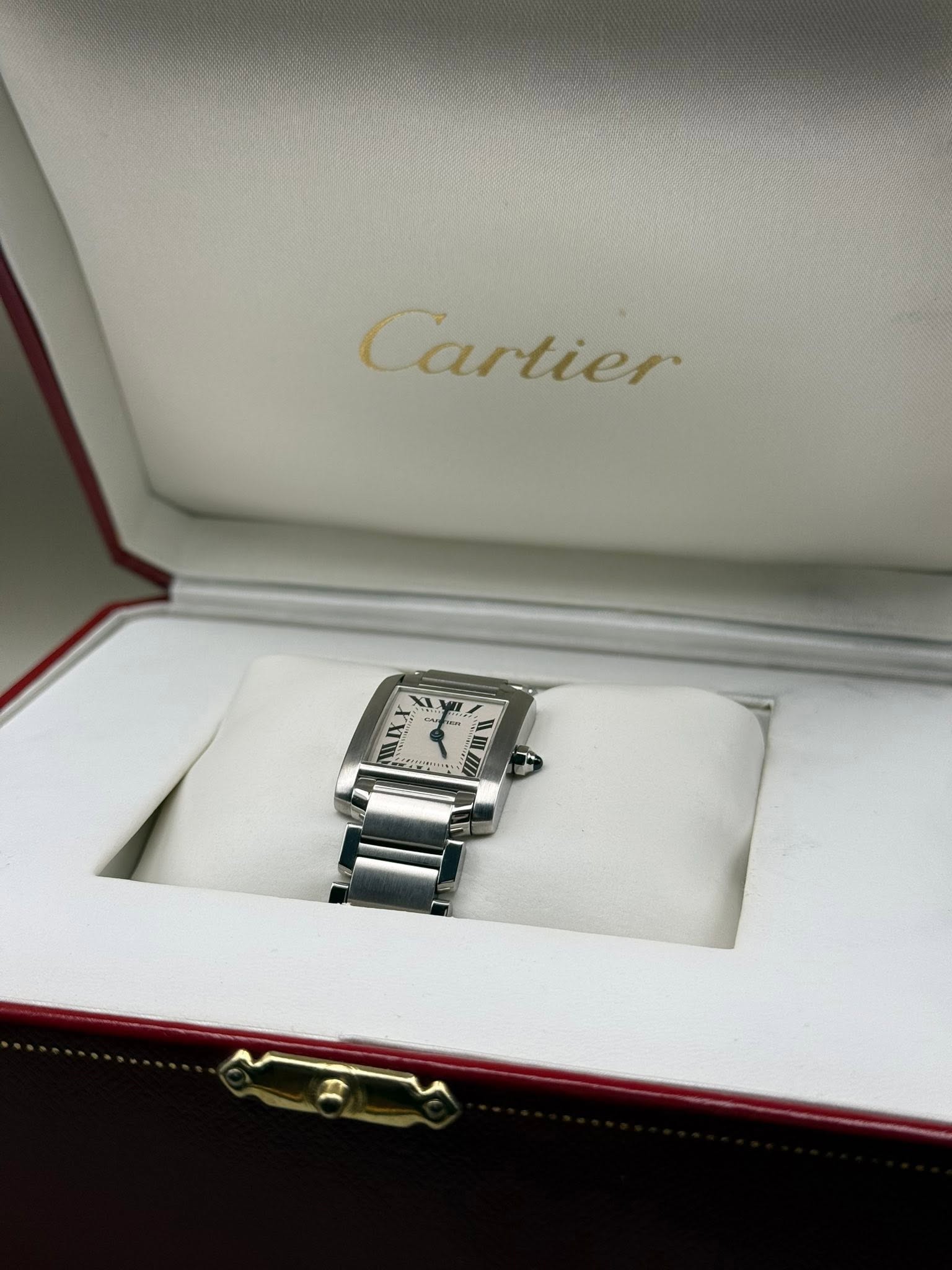 May be an image of wrist watch and text that says 'Cartier ILY'