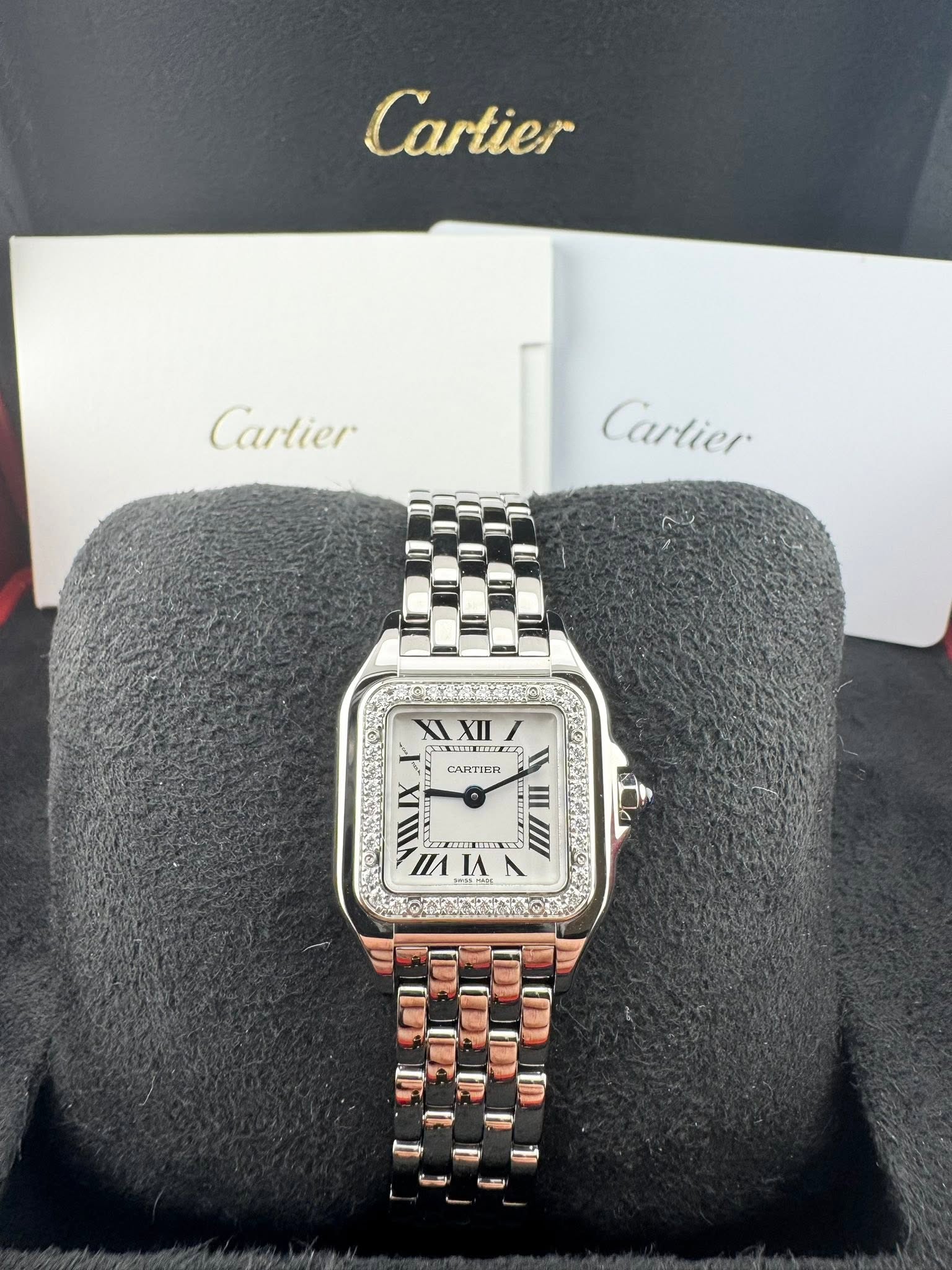 May be an image of wrist watch and text