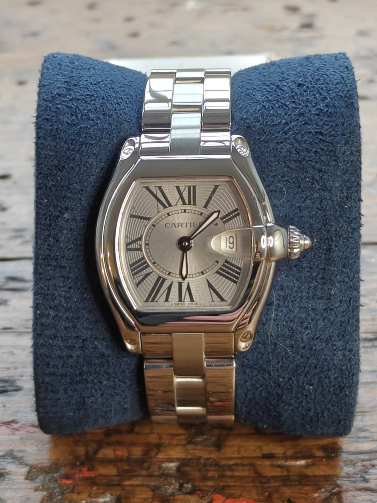 May be an image of wrist watch and text