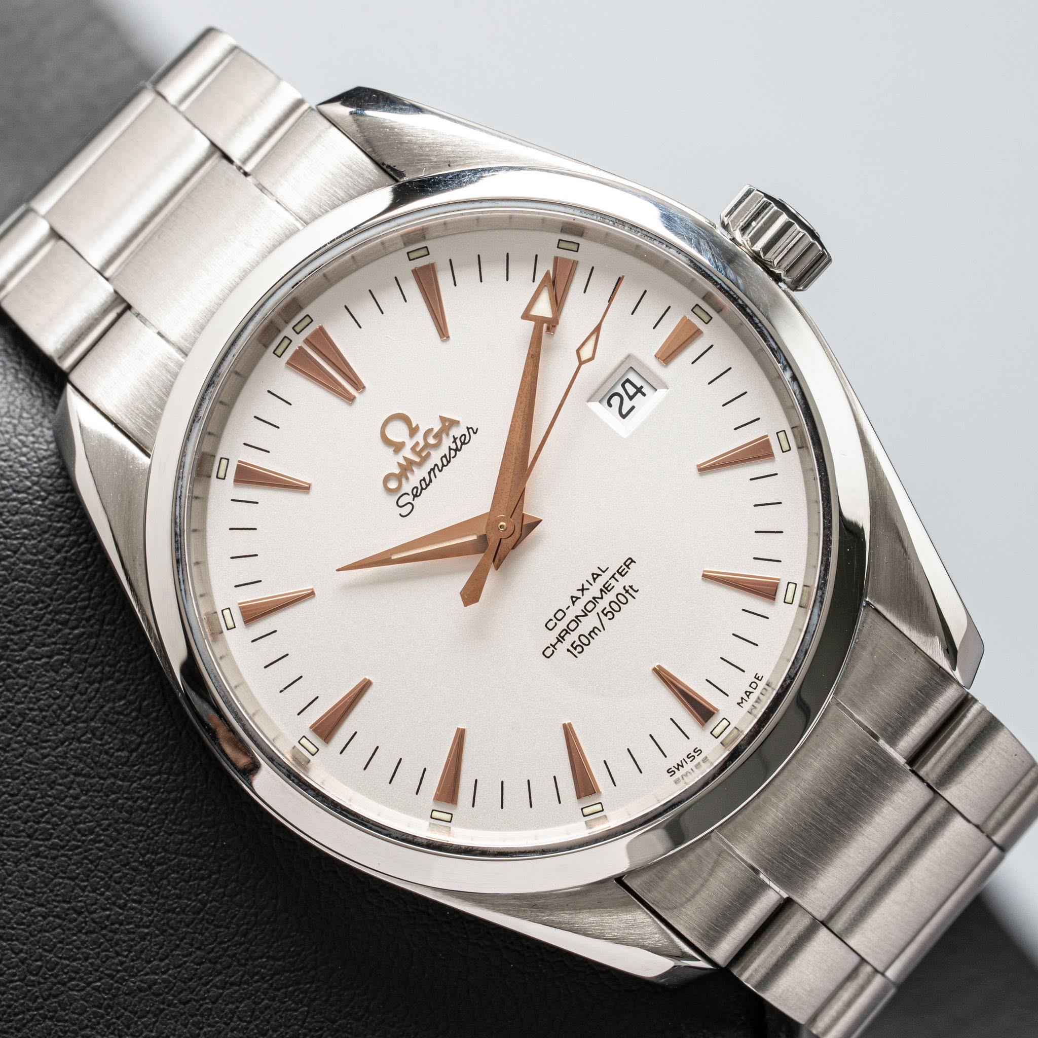 May be an image of wrist watch and text that says '0 0 ( D 2 ح OMEGA Seamaster C AXIAL ER CO. RONOMETER UON 150m O 500ft D HesE .ភា00 9 SWISS O'