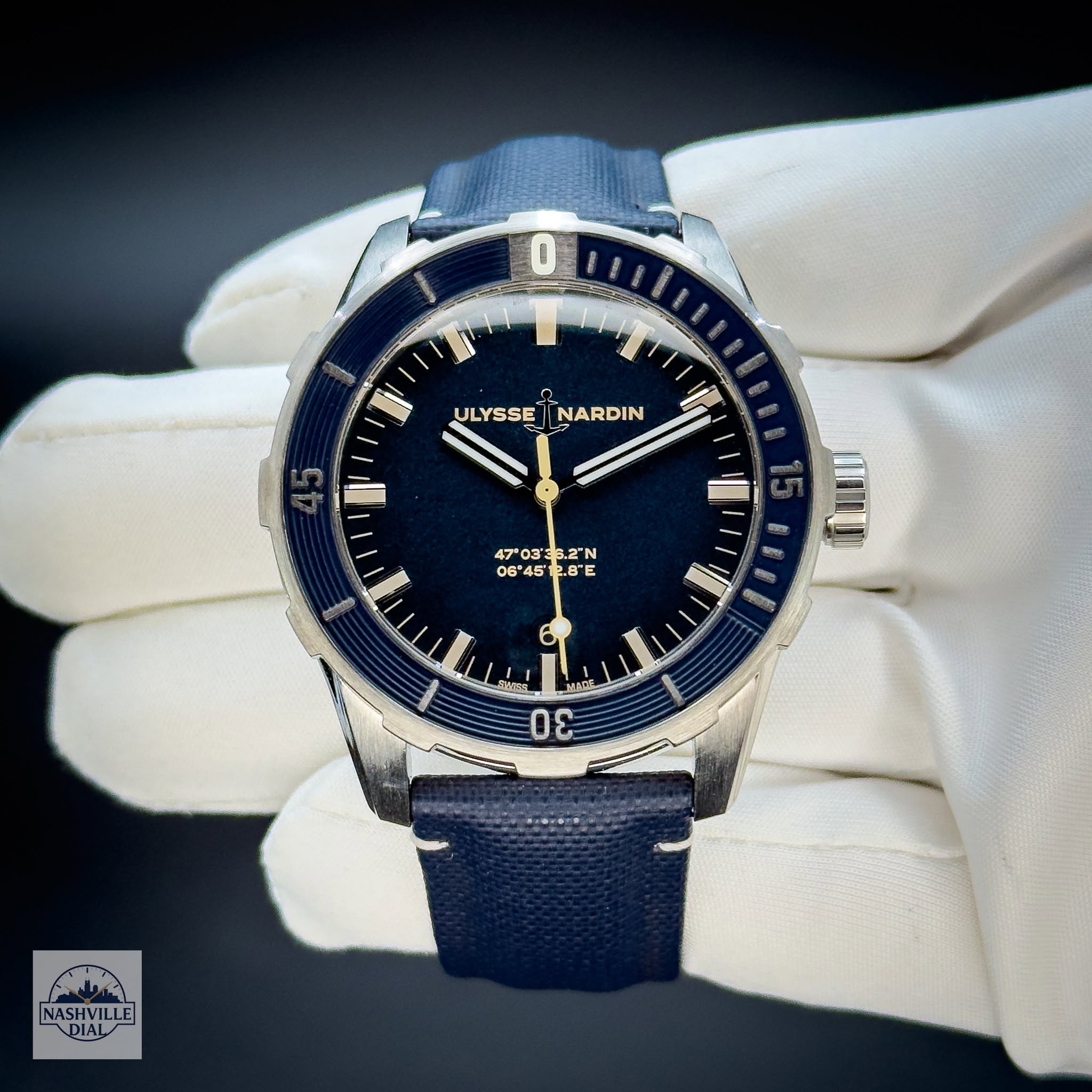 May be an image of wrist watch and text that says 'JLYSSE ULYSSEJNARDIN NARDIN I 47'03' 03'35.2"N S.2"N 06 06*45' 45'12.8E 12.8 8E E 6 ស S Adin NASHVILLE DIAL'