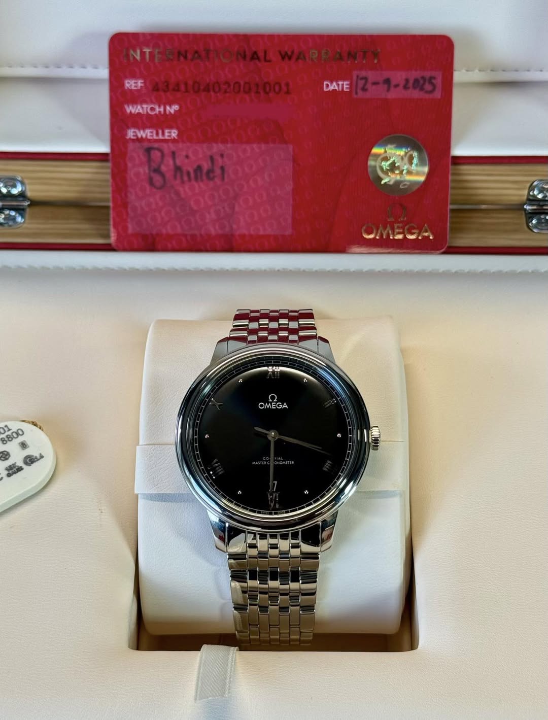 May be an image of digital watch and text that says 'NTERNA REF WATCHN N DATE (2-9-2025 JEWELLER Bhindi m3mme AO 88 8800 肉 SIL4 OMEGA'