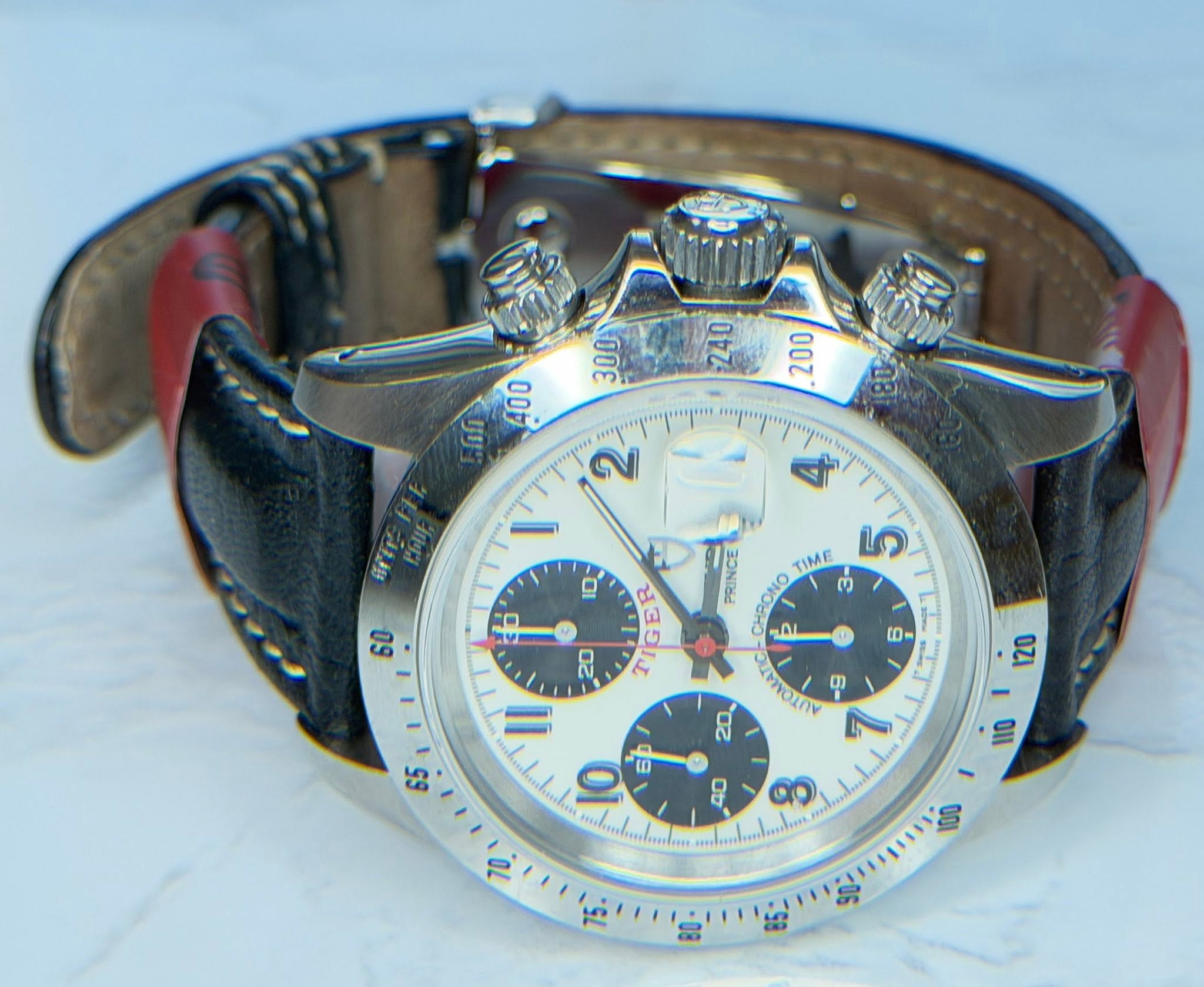 May be an image of wrist watch and text