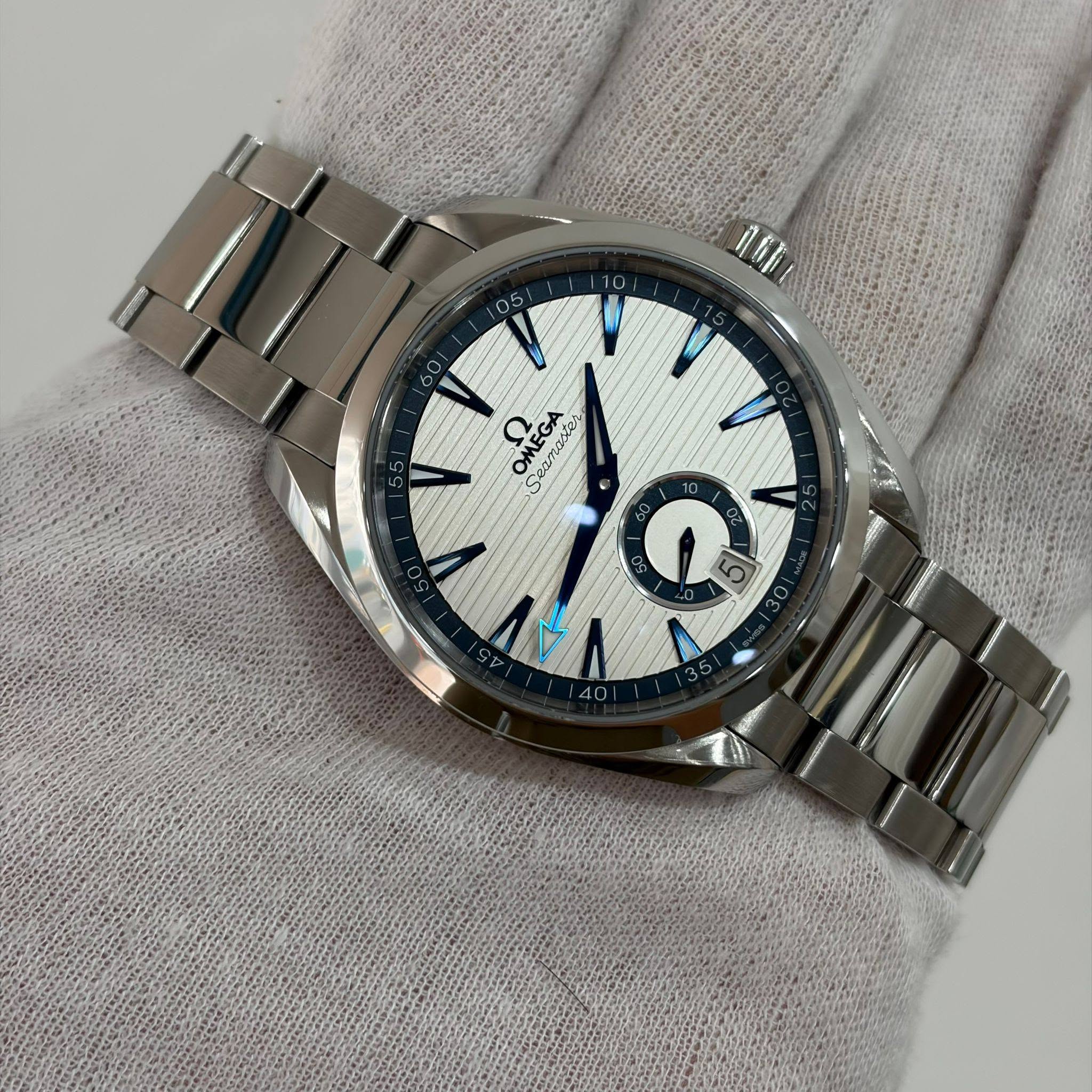 May be an image of wrist watch and text