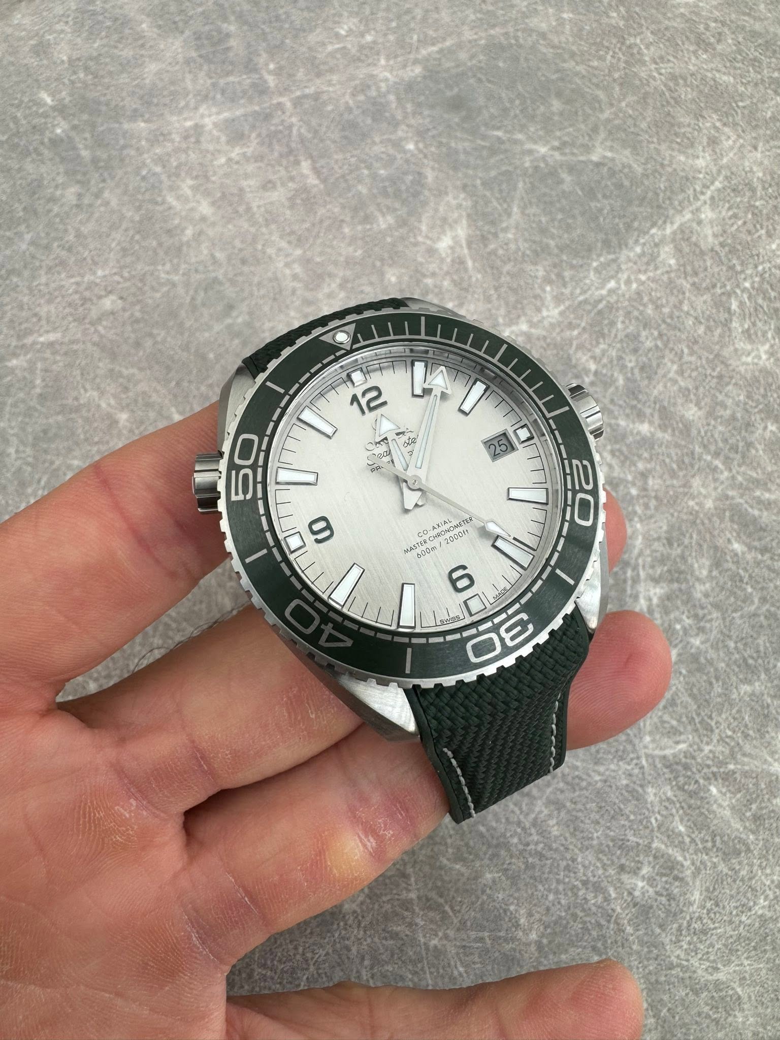 May be an image of wrist watch and text