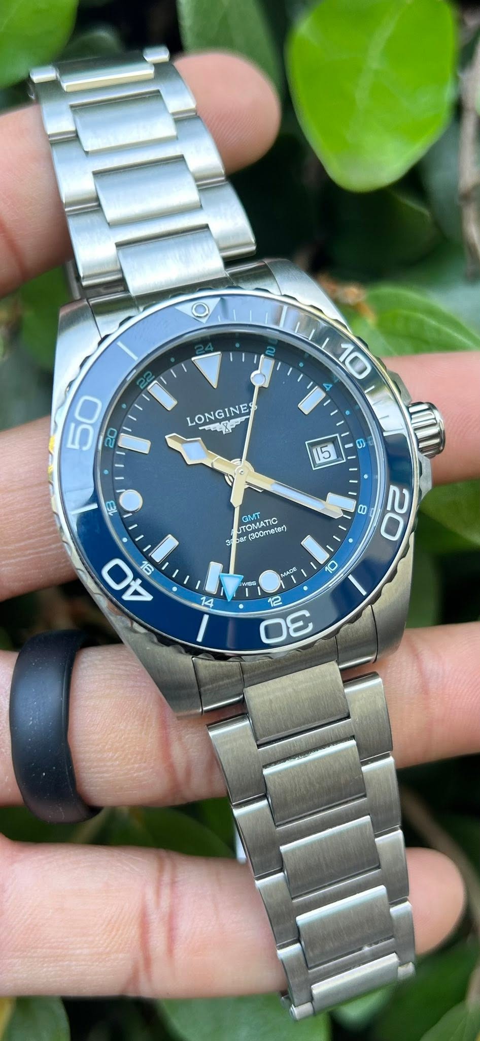 May be an image of wrist watch and text