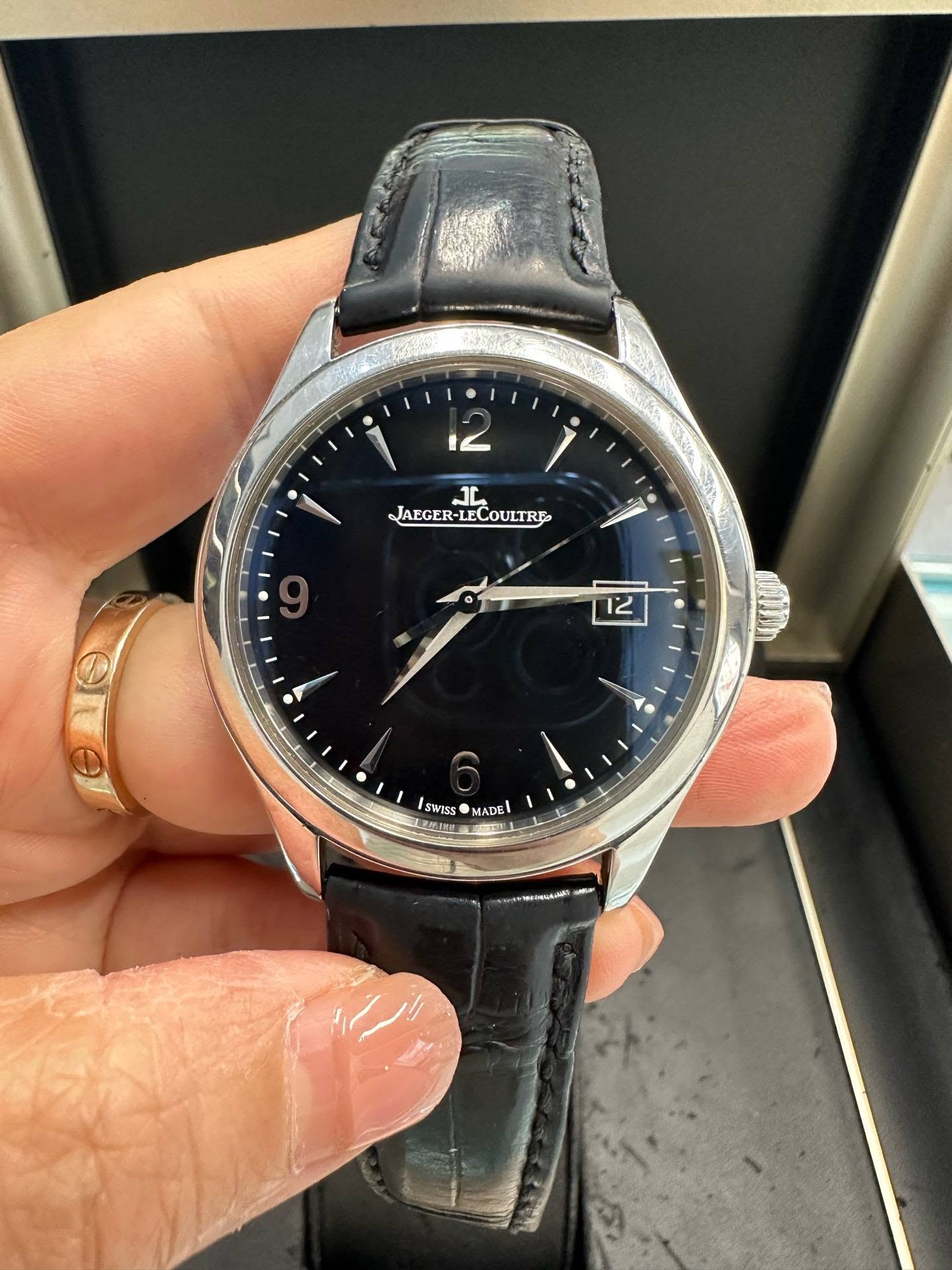 May be an image of wrist watch and text