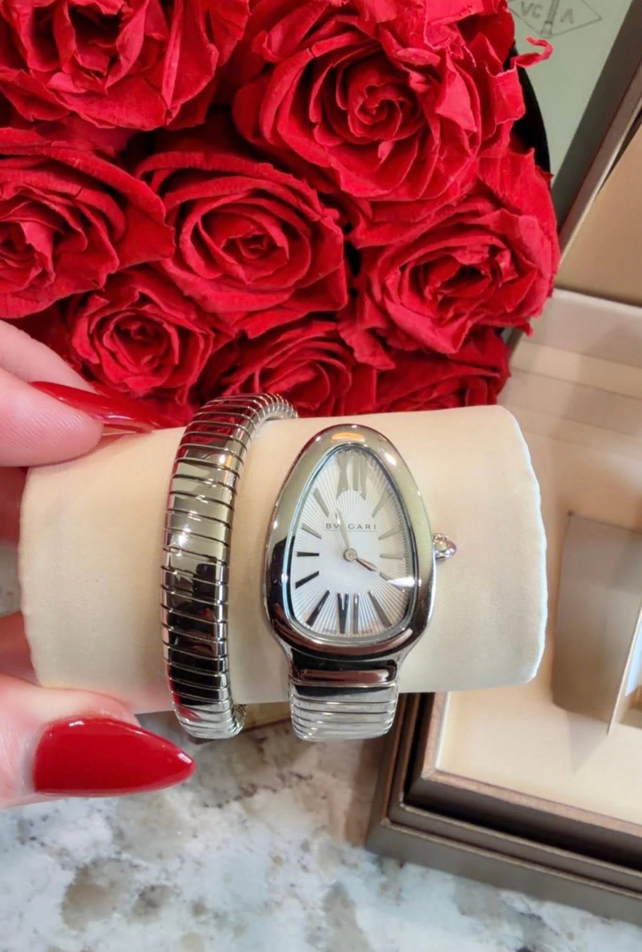 May be an image of wrist watch and jewelry