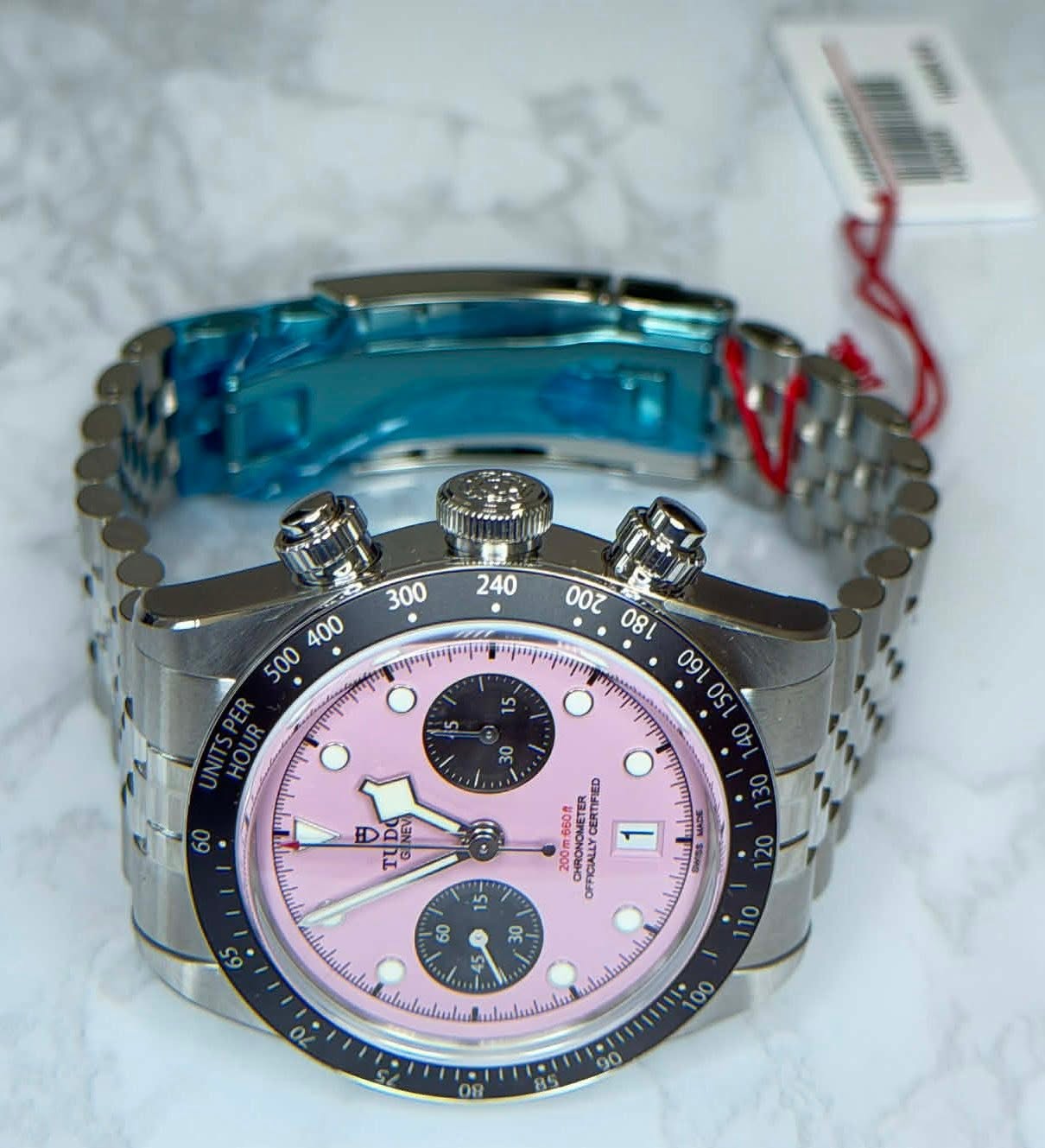 May be an image of wrist watch and text