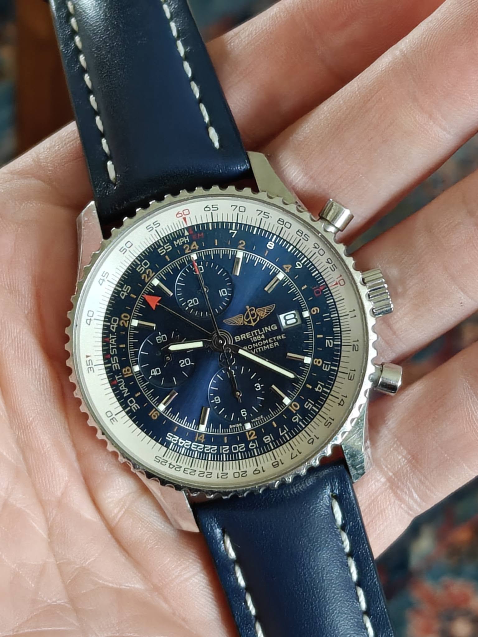 May be an image of wrist watch and text