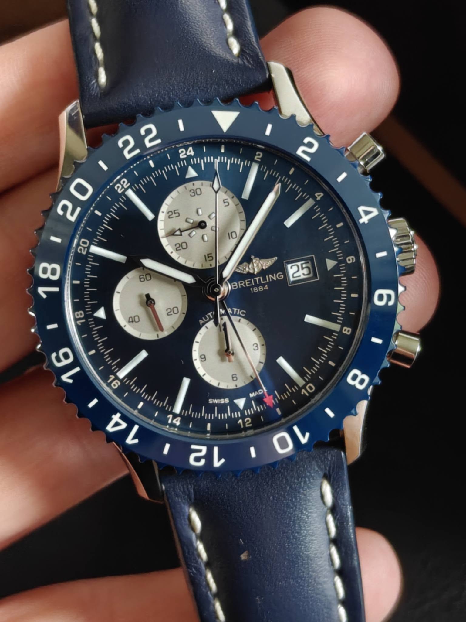 May be an image of wrist watch and text that says ' מחוקיייקיייןין ויקויייחייקיייןי و BREITLING 884 TLING 25 40 20 ATIC UT g mula 4 14 O 8 MAD SWISS / IIH 12 I 0 己'