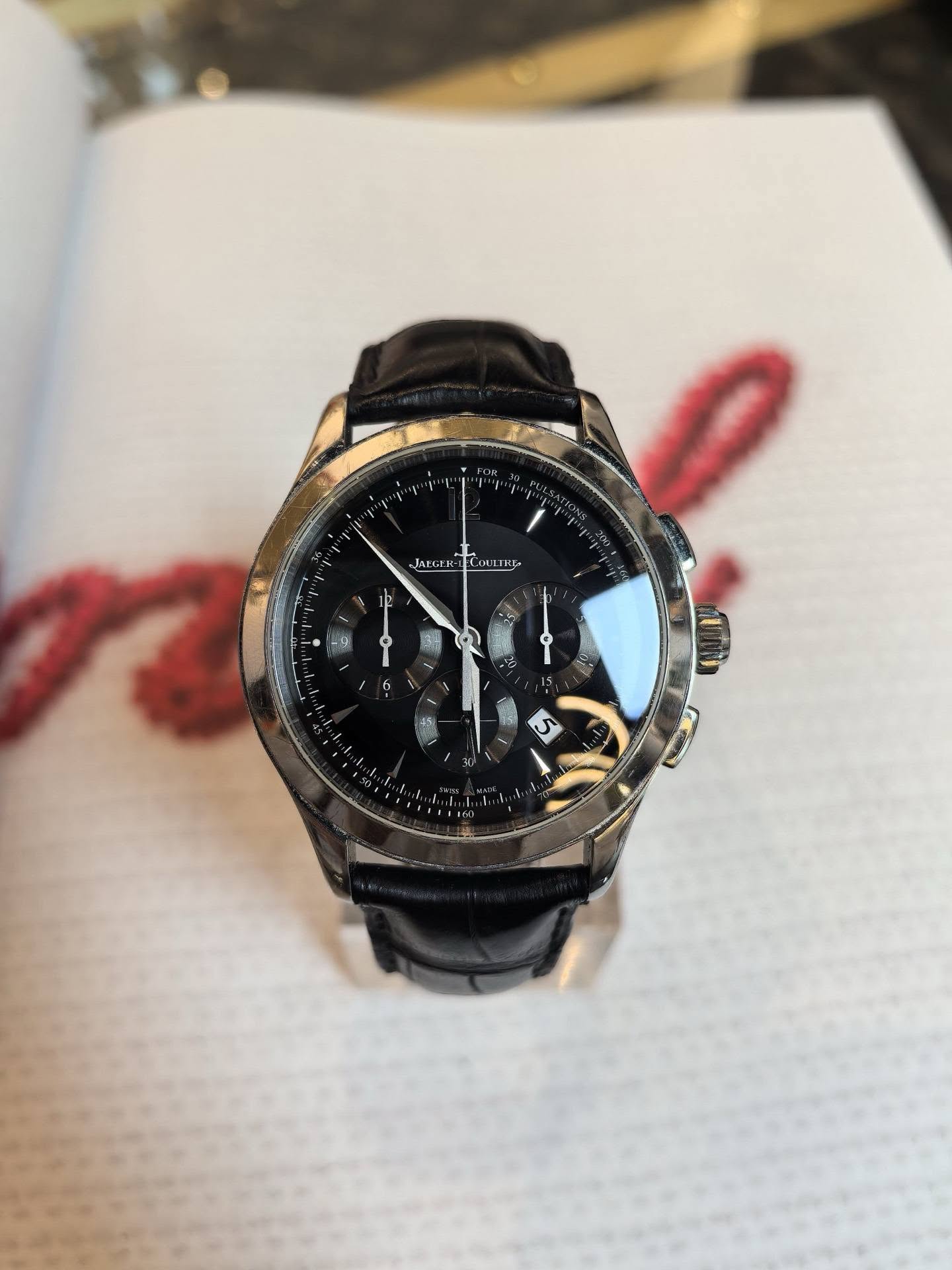 May be an image of wrist watch and text