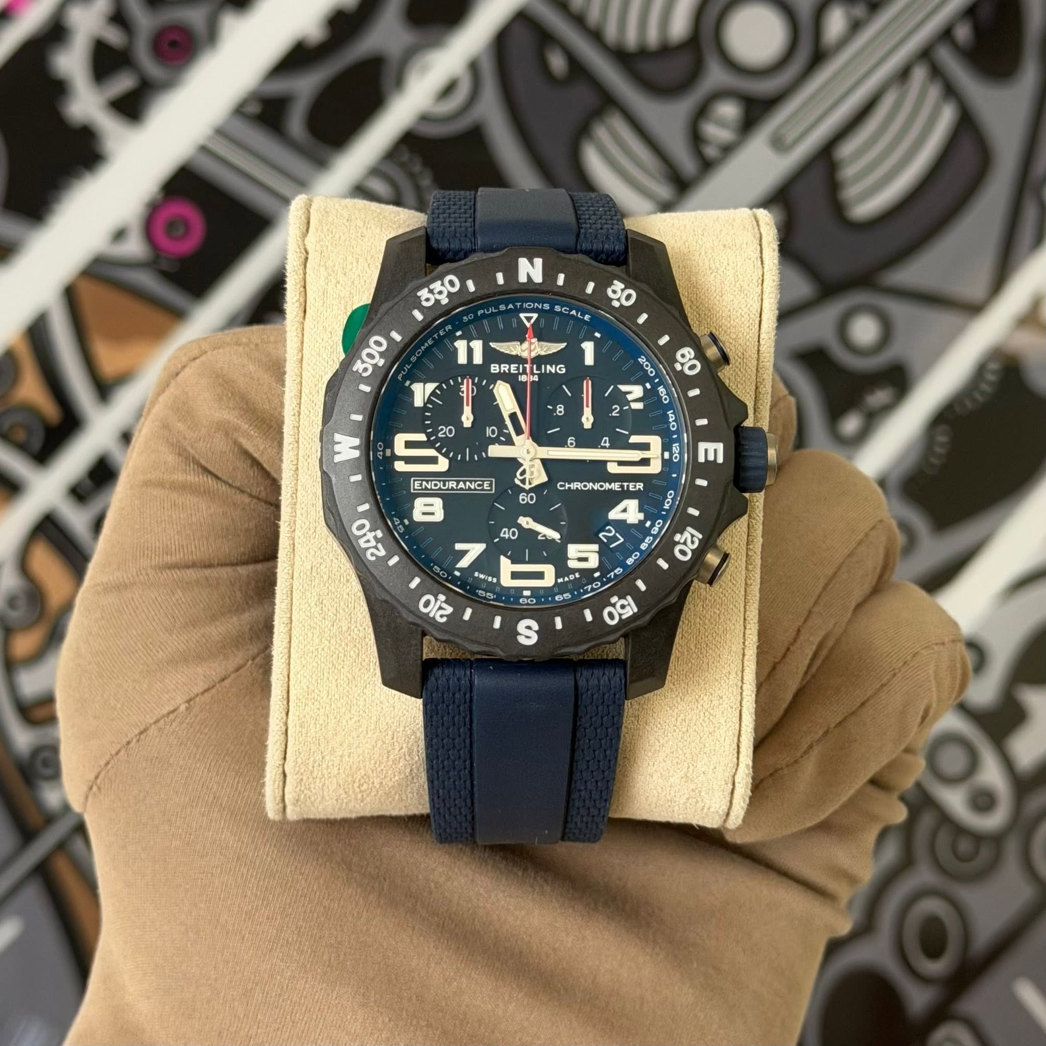 May be an image of wrist watch and text that says 'N SCALE BREIT DREITLING ING 8 W RACD Ao 60 A N 160 1n0. 10 m CHRONOME ER R 00 B 85 ಸ က 60 5 20 ENDURANCE 240 3 SW 210 40 3> = 1e…