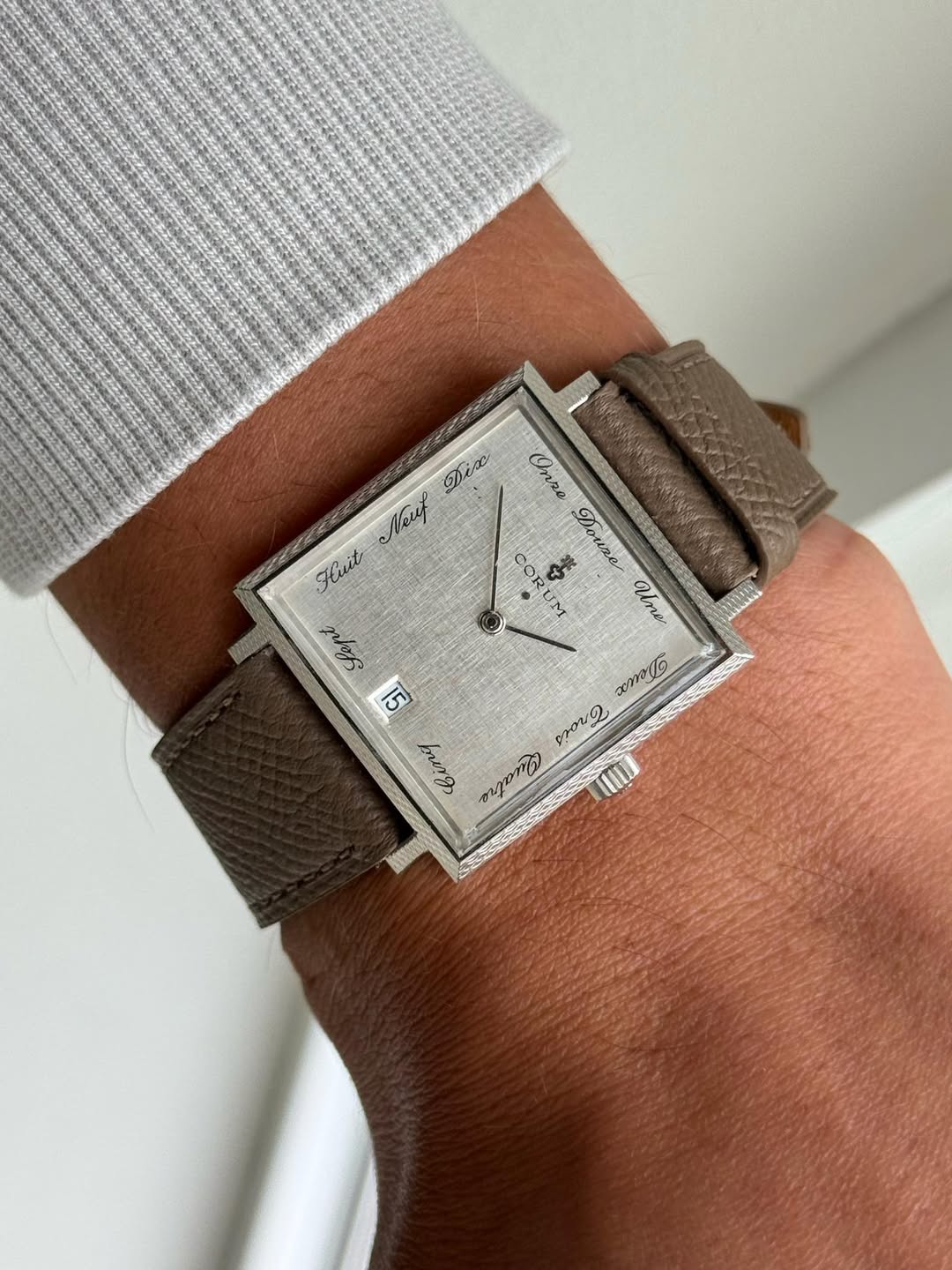 May be an image of wrist watch and text