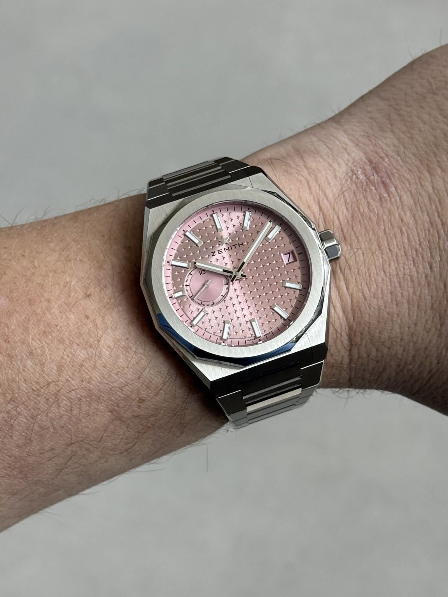 May be an image of wrist watch and text