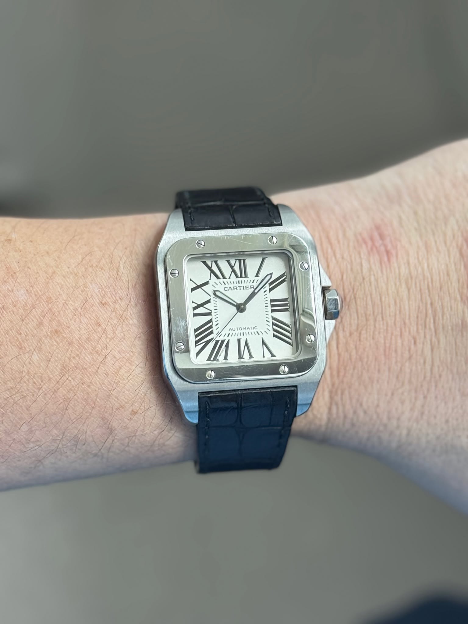 May be an image of wrist watch and text