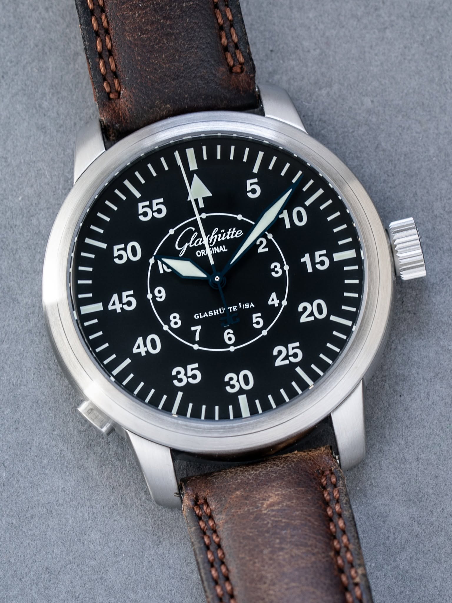 May be an image of wrist watch and text that says ' Globütte OR INAL Glo hütte GLASHU TE ISA '
