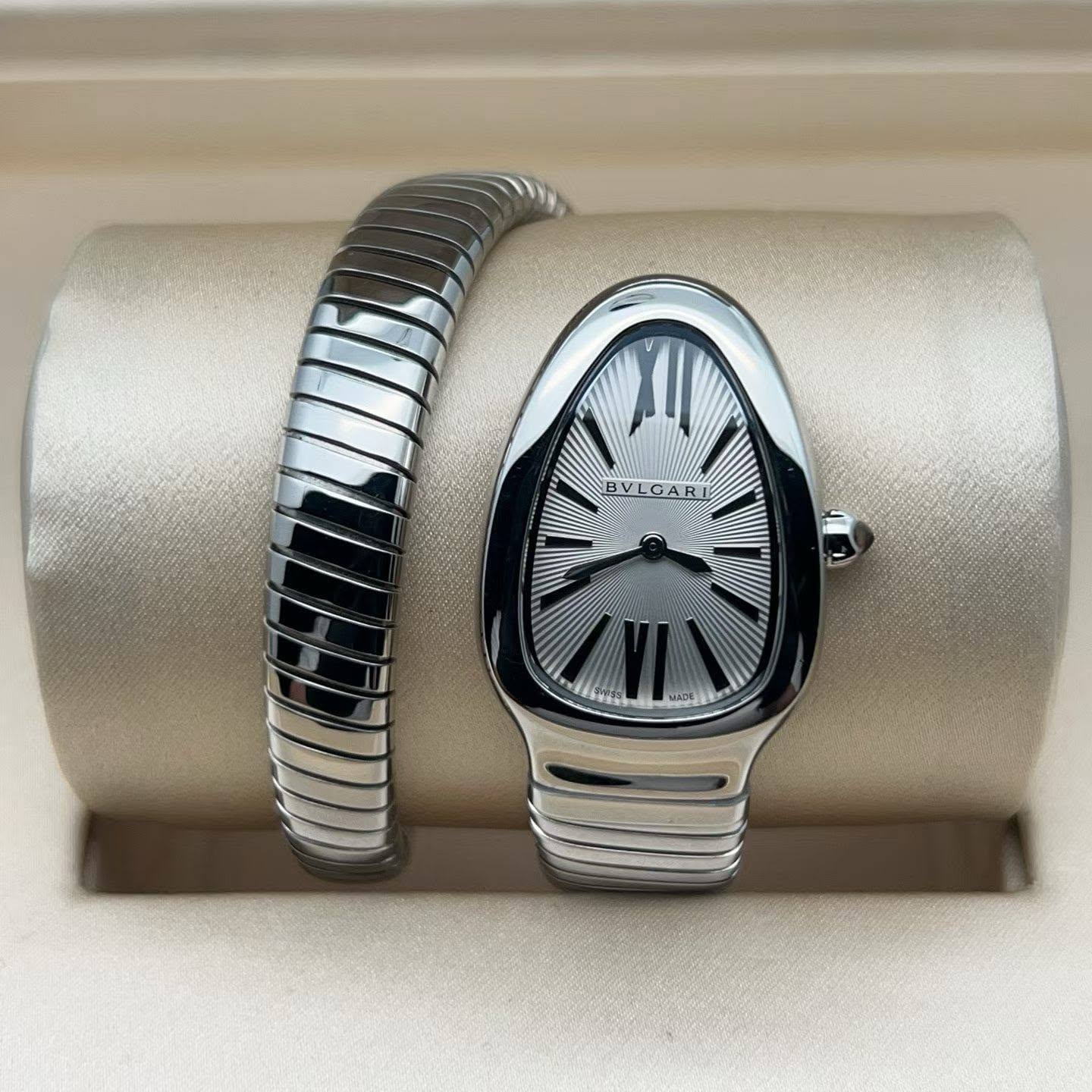 May be an image of jewelry, digital watch and text