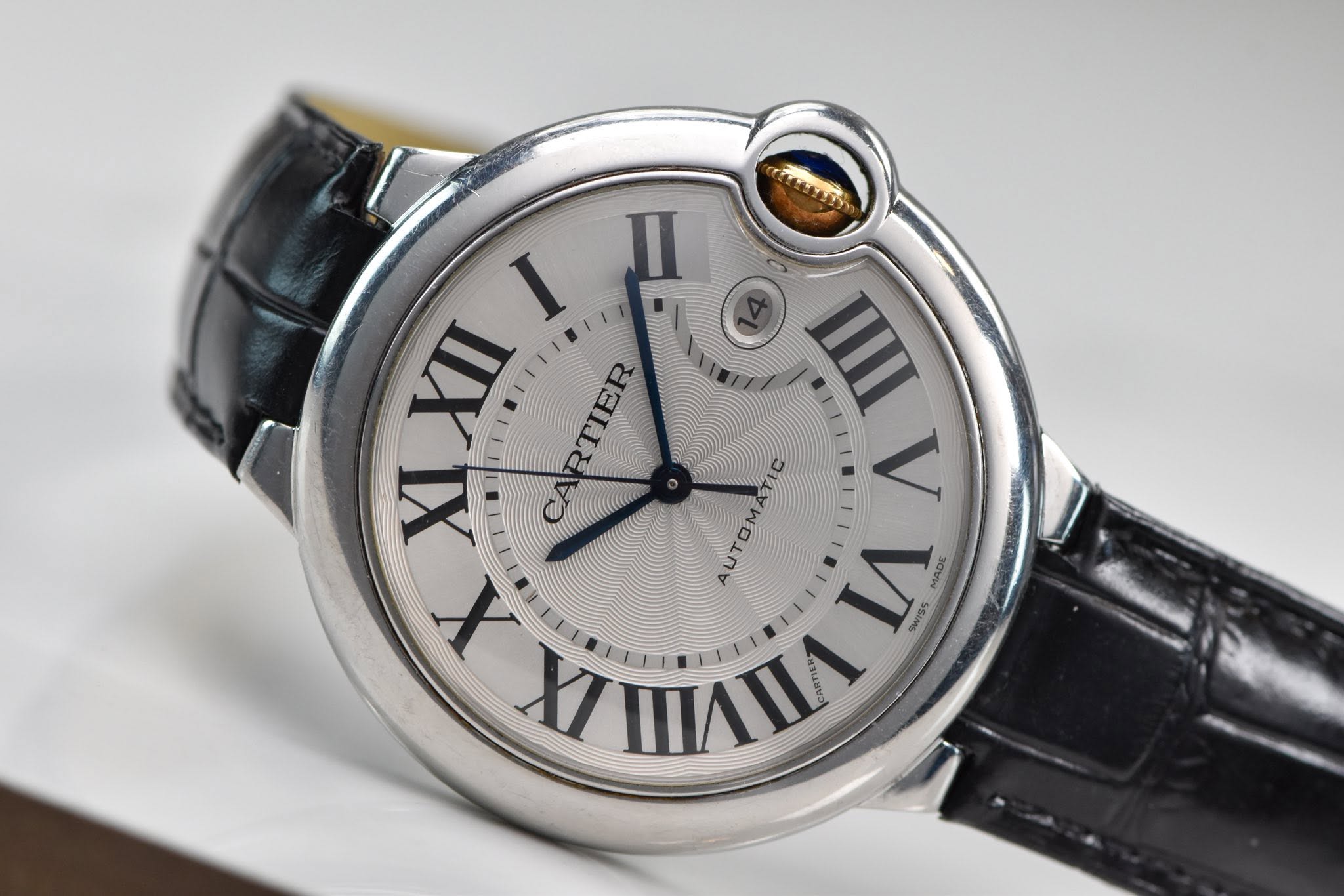 May be an image of wrist watch and text that says 'I n RTIER TIEE IIII XI AUTOMATIC V SWISS רדו ν X MADE IX ரா M3LL L'