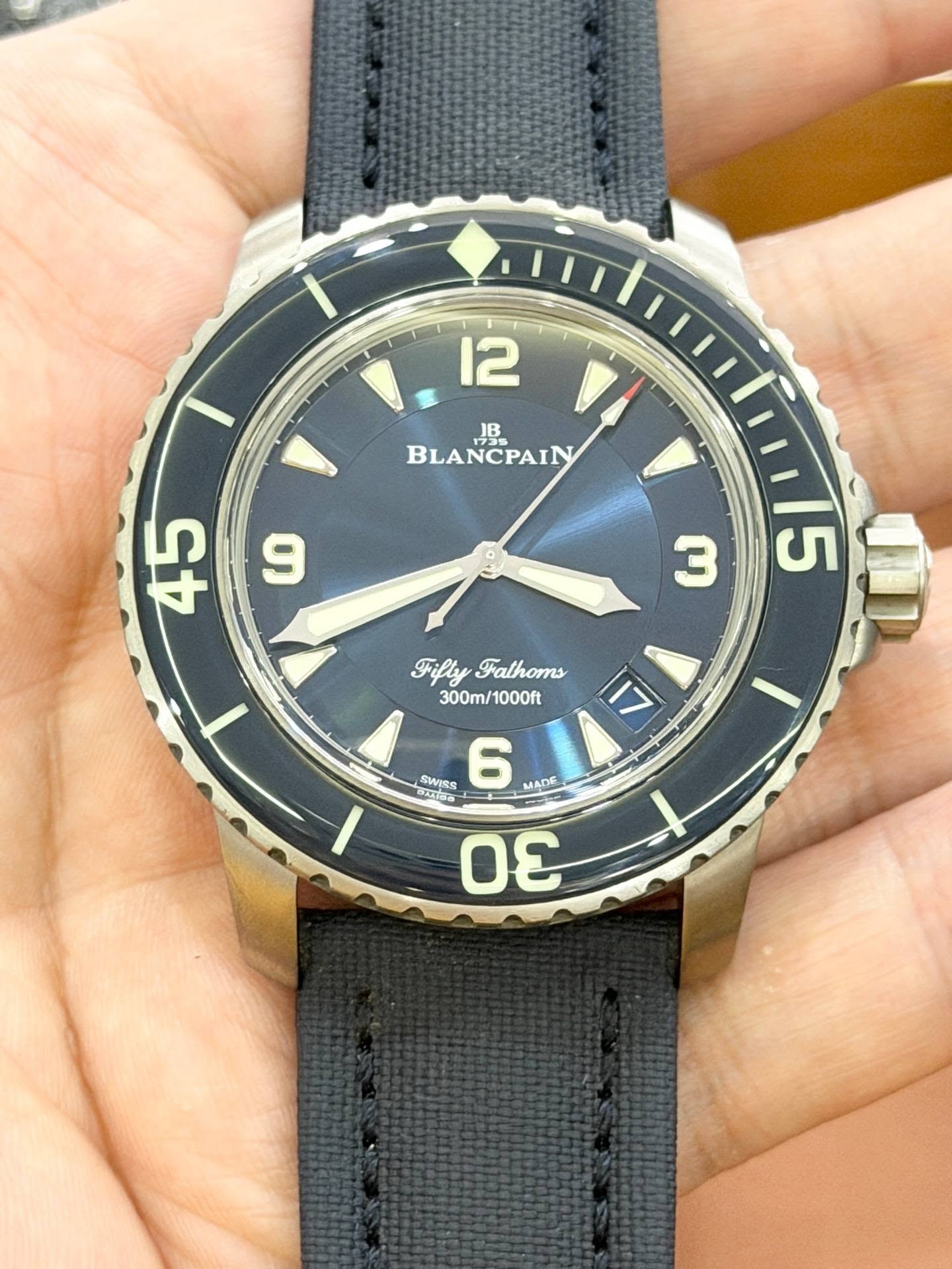 May be an image of wrist watch and text that says '12 BLANCPAIN BLA 9 45 3 5 y FiflyFalhoms Falhoms 300m/ 300m/1000ft 1000ft 17 P SWISS 6 -MADE MADE m Οε'
