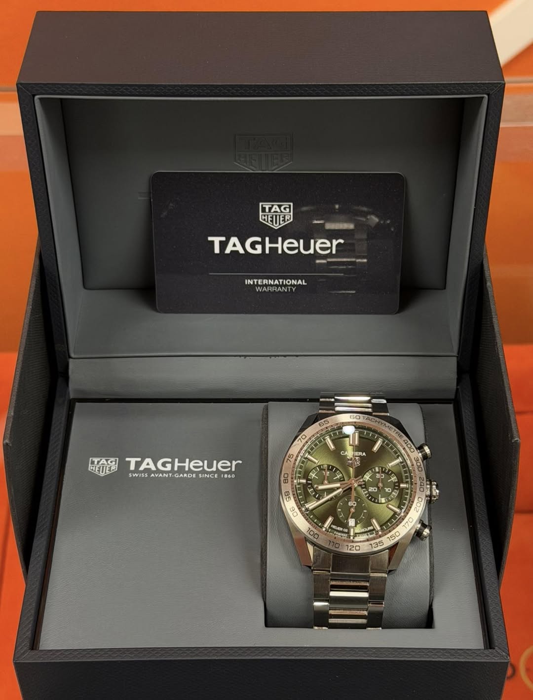 May be an image of wrist watch and text that says 'TAG HETER TAGHeuer INTERNATIONAL 60 8S 70 75 TAG TAGHeuer HEUED SWISSA SWISS AVANT GARDE SWISSAYANT-GARDESINCEIS6O SINCE 860 CA…
