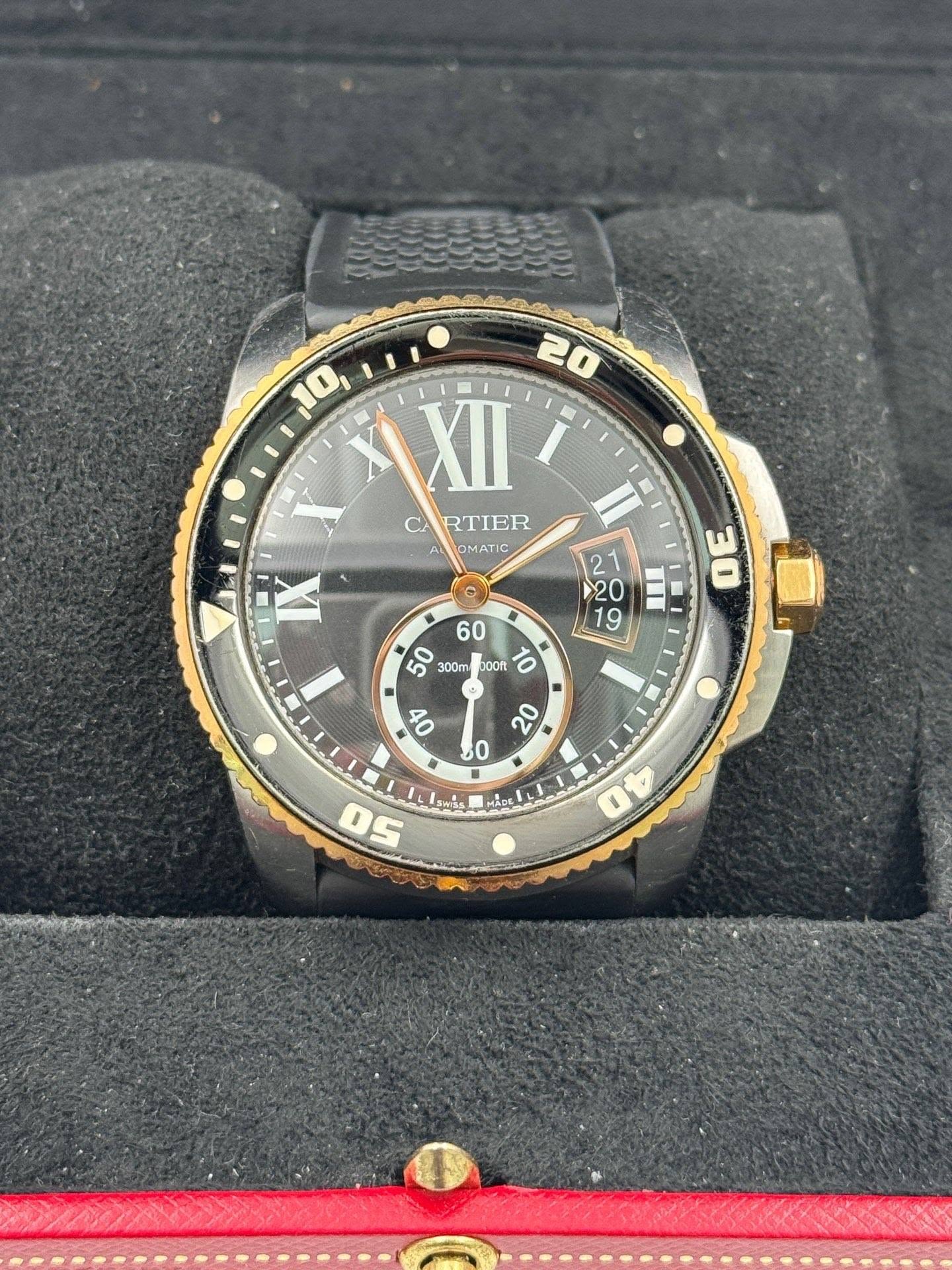 May be an image of wrist watch and text that says '10 20 XII C RTIER OMATIC X X 300m ០០ ትርኝ MS טכןל O 50 40'