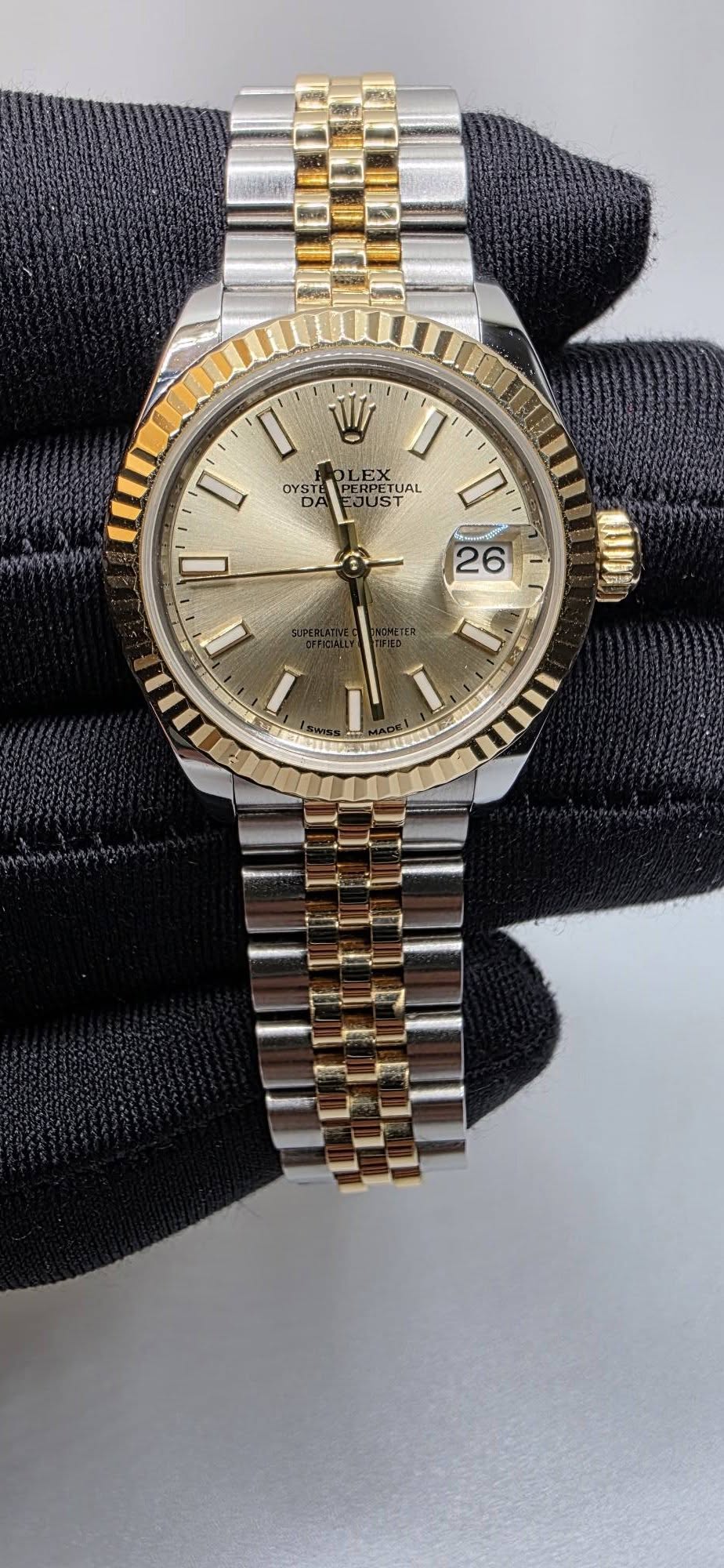 May be an image of wrist watch and text