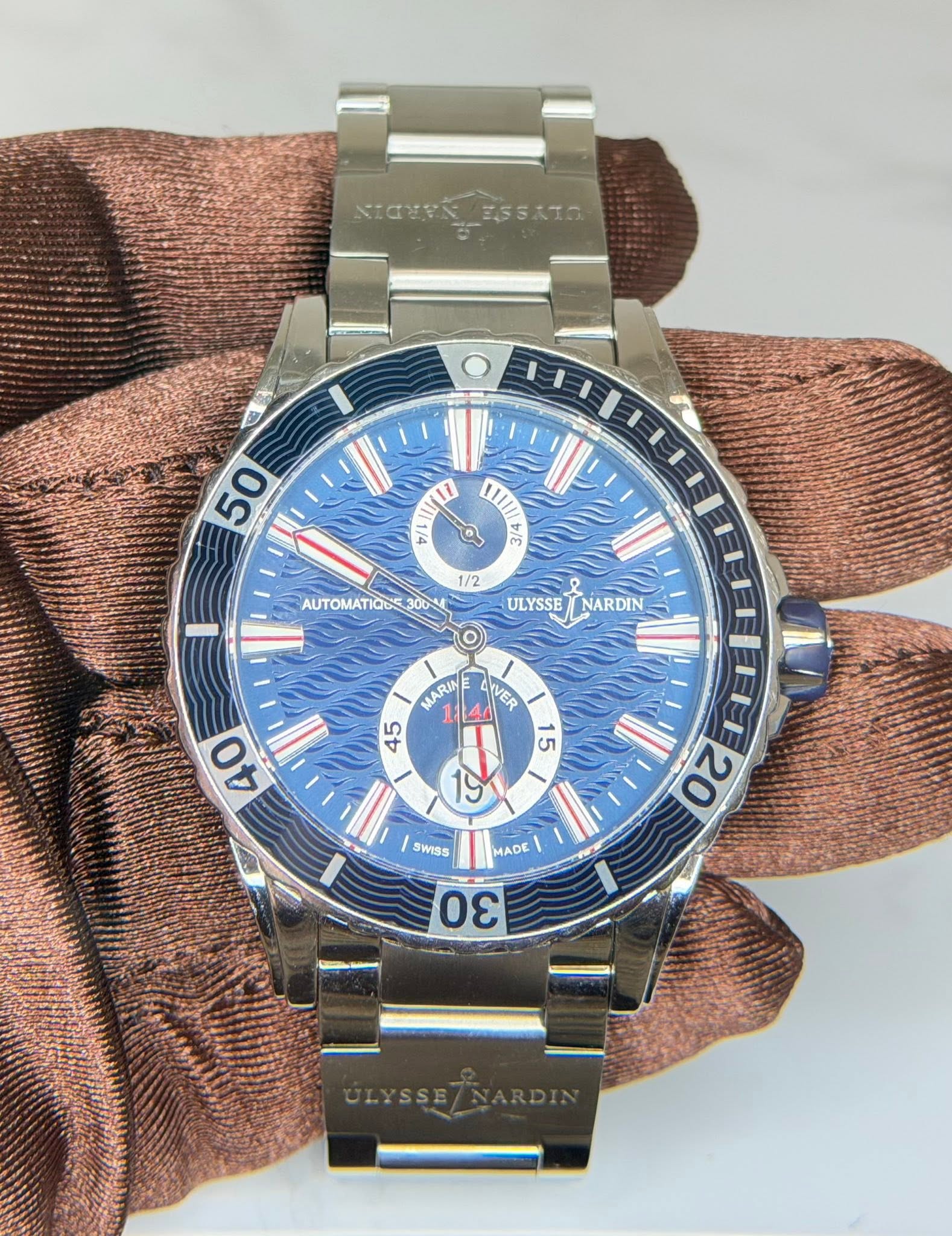 May be an image of wrist watch and text