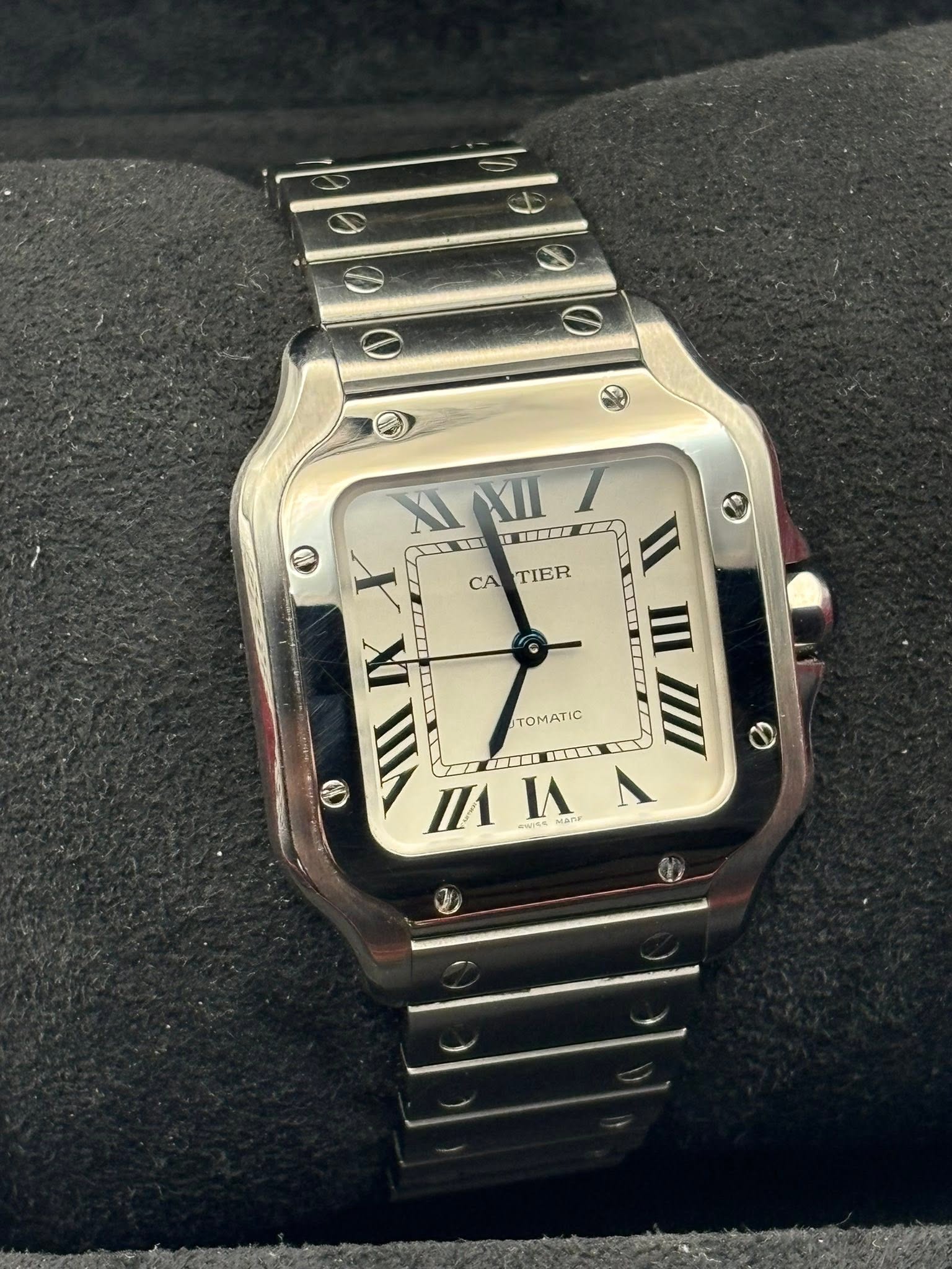 May be an image of wrist watch and text