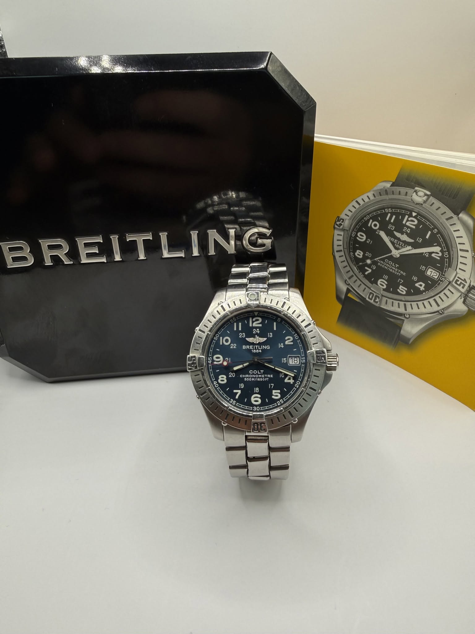 May be an image of wrist watch and text