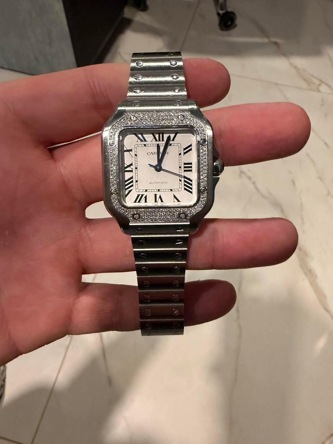May be an image of digital watch and text