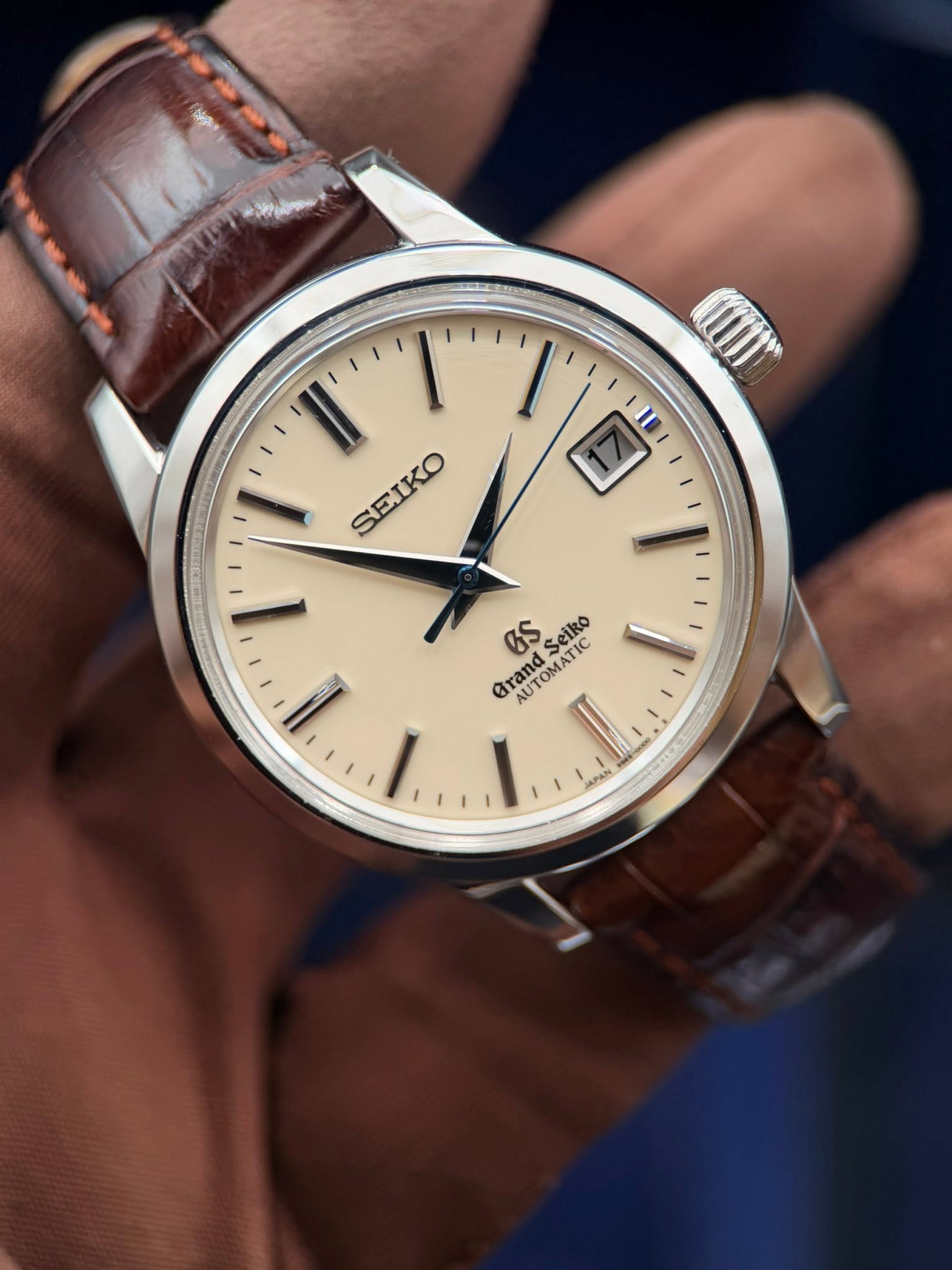 May be an image of wrist watch and text that says 'لل SEIKO aS Seiko Grand GrandSeir AUTOMATIC OTOMATI 1 APAN'