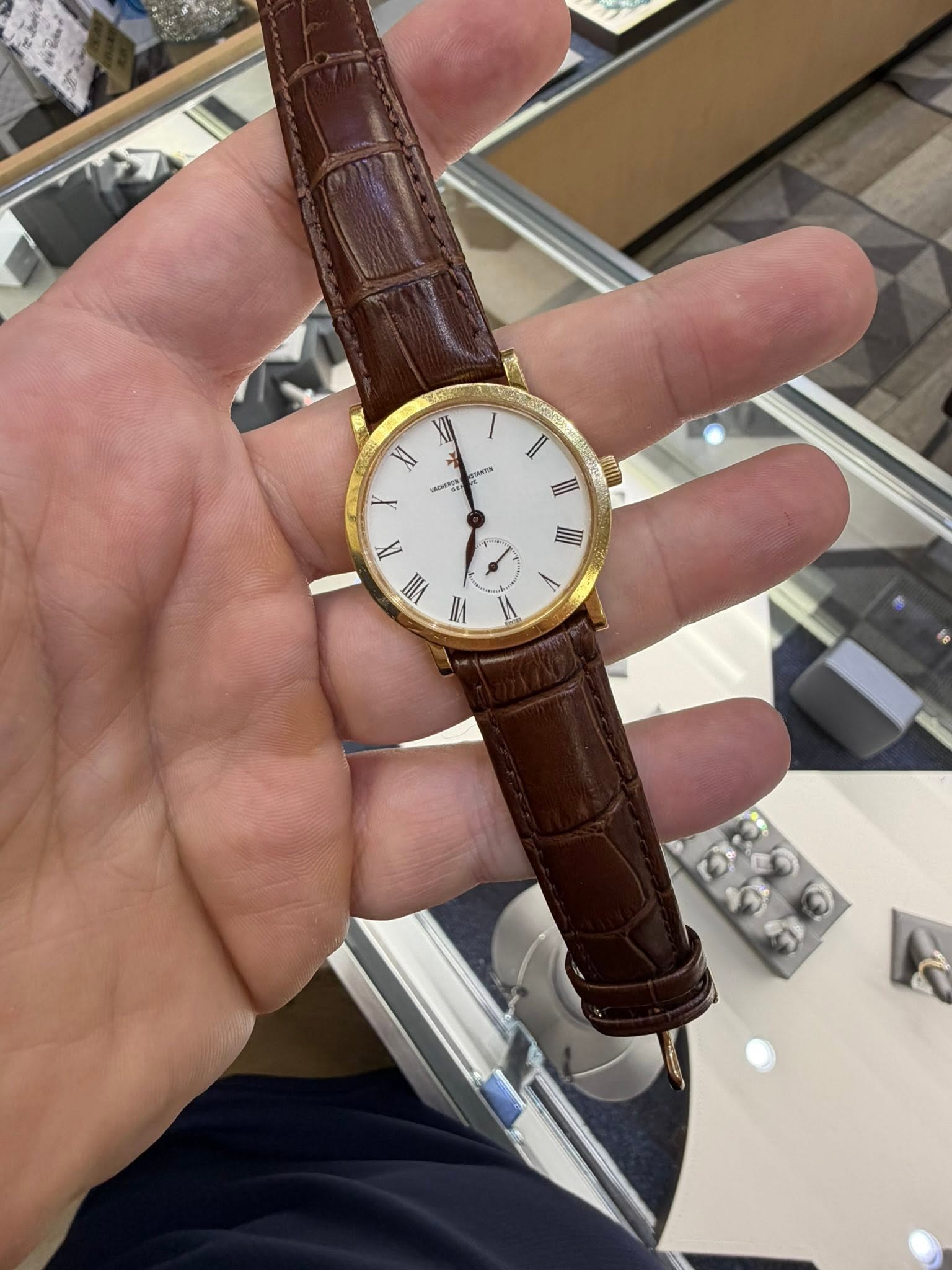May be an image of wrist watch and text