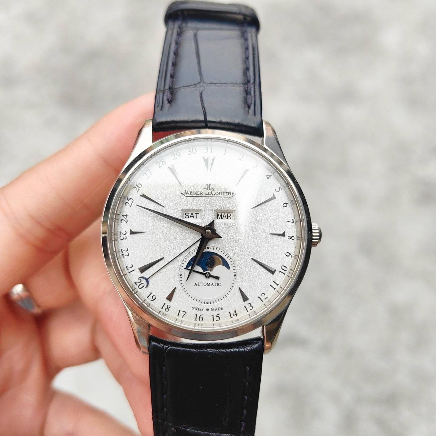 May be an image of wrist watch and text